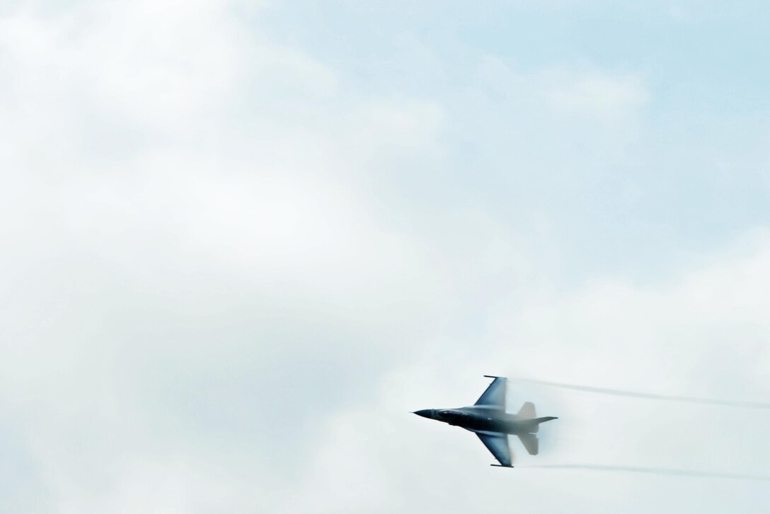 A F-16CM Fighting Falcon piloted by U.S. Air Force Maj. John Waters, F-16 Viper Demonstration Team pilot, soars over Shaw Air Force Base, S.C., during a “Wild Weasel” reunion, June 23, 2017. Shaw hosted a reunion for the Wild Weasels in recognition of their 52nd anniversary, providing insight on the current 20th Fighter Wing and Wild Weasel missions.  (U.S. Air Force photo by Airman 1st Class Kathryn R.C. Reaves)