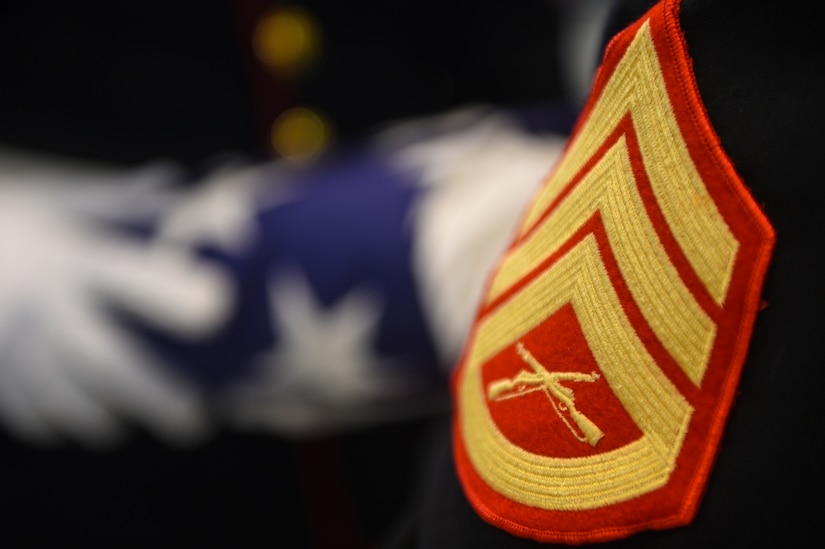 U.S. Marine Corps members of the Combat Logistics Battalion 451 Detachment 3, present a folded American flag during a practice session at Joint Base Charleston - Weapons Station, S.C., June 21, 2017. The unit performs primarily funeral honors, but they will occasionally do color performances as well. 