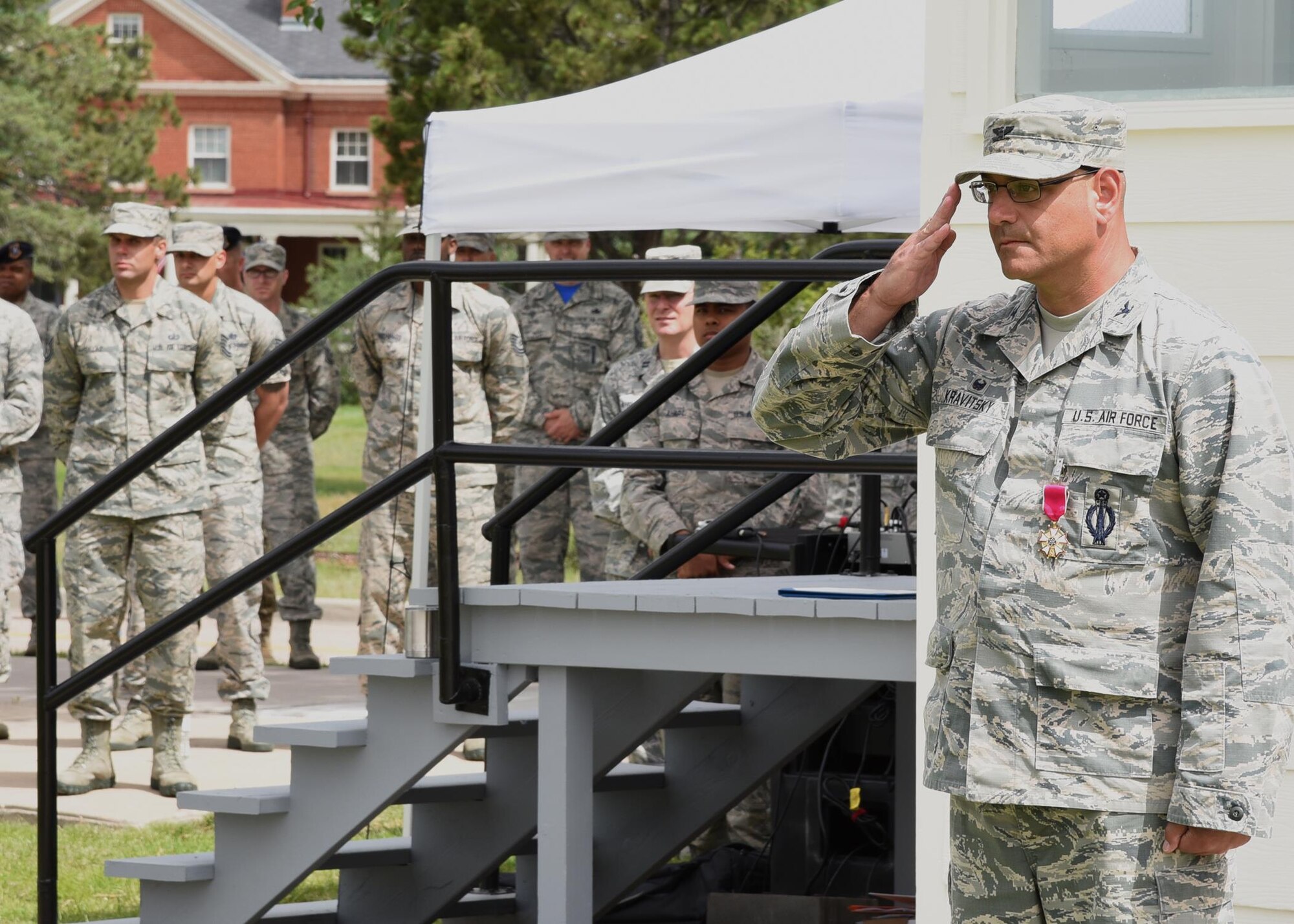 Colonel Stephen Kravitsky, 90th Missile Wing commander, returns the final salute given to him by his troops at the change of command ceremony on the Argonne Parade Field at F.E. Warren Air Force Base, Wyo., June 23, 2017. (U.S. Air Force photo by Glenn S. Robertson)