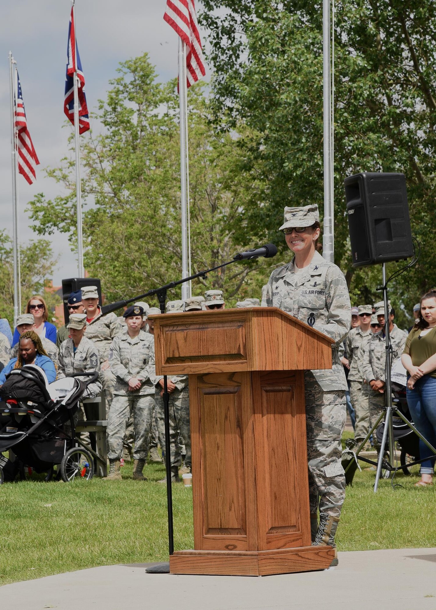 Colonel Stacy Huser, 90th Missile Wing commander, speaks to the crowd attending the 90th Missile Wing Change of Command on the Argonne Parade Field at F.E. Warren Air Force Base, Wyo., June 23, 2017. She took time to thank the supporters, mentors and leaders who helped her along the way. (U.S. Air Force photo by Glenn S. Robertson)