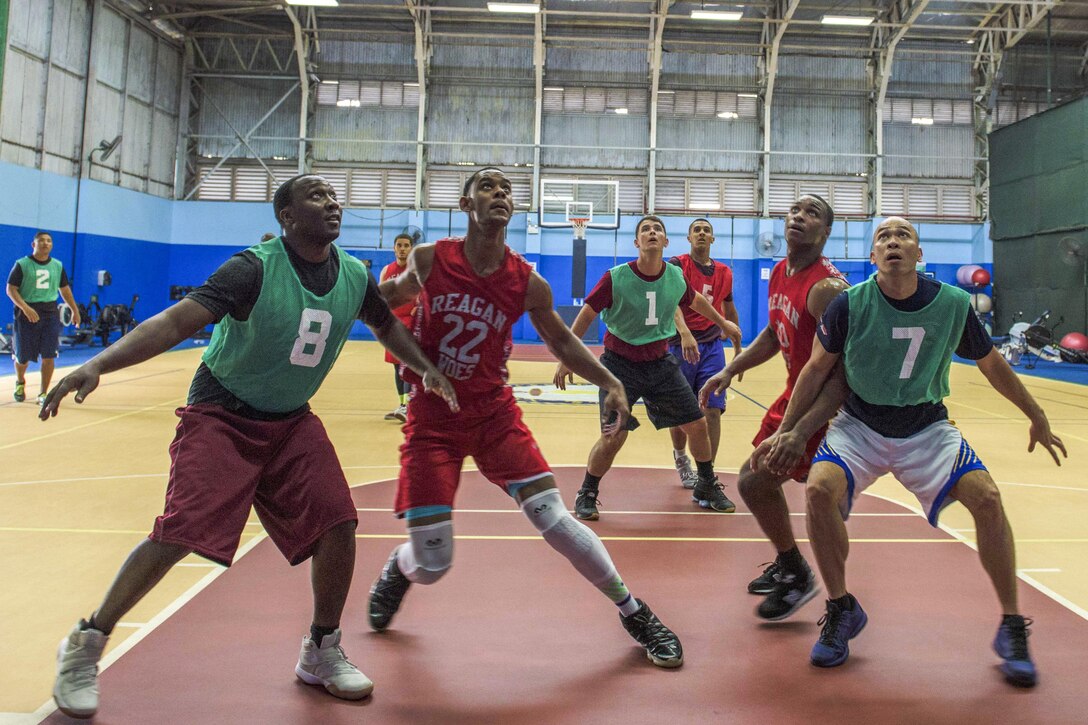 Sailors box out for a rebound during a Morale, Welfare and Recreation-sponsored basketball game against a team in Singapore, June 19, 2017. The sailors, assigned to the USS Ronald Reagan, were in Singapore for a port visit. Navy photo by Petty Officer 2nd Class Kenneth Abbate