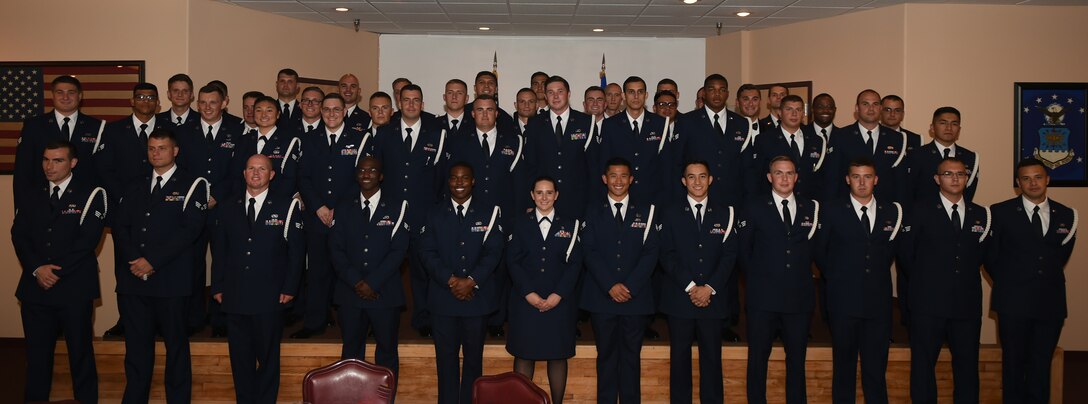 U.S. Air Force Airmen sing the Air Force song after their Airman Leadership School Graduation at Dyess Air Force Base, Texas, June 22, 2017. ALS is an approximately five week-long Air Force program designed to develop Airmen into effective front-line supervisors. It is the first professional military education that enlisted Air Force members encounter. ALS focuses on developing leadership abilities as well as effective communication. (U.S. Air Force photo by Airman 1st Class Emily Copeland)