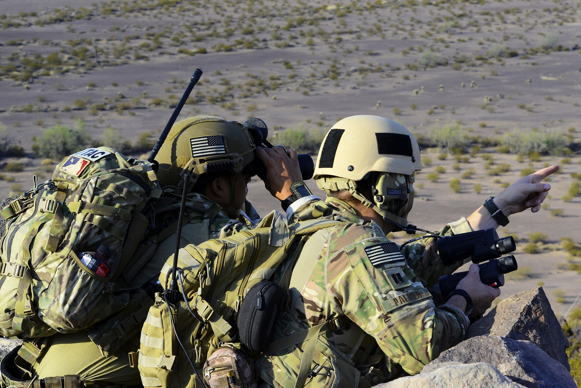 Capt. William Palmer, 10th Air support Operations Squadron air liaison officer, and Airman 1st Class Anthony Butler, 10th ASOS joint terminal attack controller, identify potential targets, June 22, 2017, at Barry M. Goldwater Range, Ariz. 10th ASOS Airmen routinely practice calling in close air support to maintain proficiency before deployments. (U.S. Air Force photo/Staff Sgt. Trevor Rhynes) 