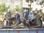 LEFT TO RIGHT: Command Sgt. Maj. James Collins, United States Army Garrison Fort Riley; Albert Marin, programs director for the Huntsville Engineering and Support Center; Joseph Cvetas, executive vice president for Southland Industries; Sandy Walker, Fort Riley Public Works; Col. John D. Lawrence, Fort Riley garrison commander, turn ceremonial dirt during a groundbreaking ceremony June 13 at Fort Riley. The ceremony highlighted the award of an energy savings performance contract to Southland Energy and commemorated the start of the construction phase.
