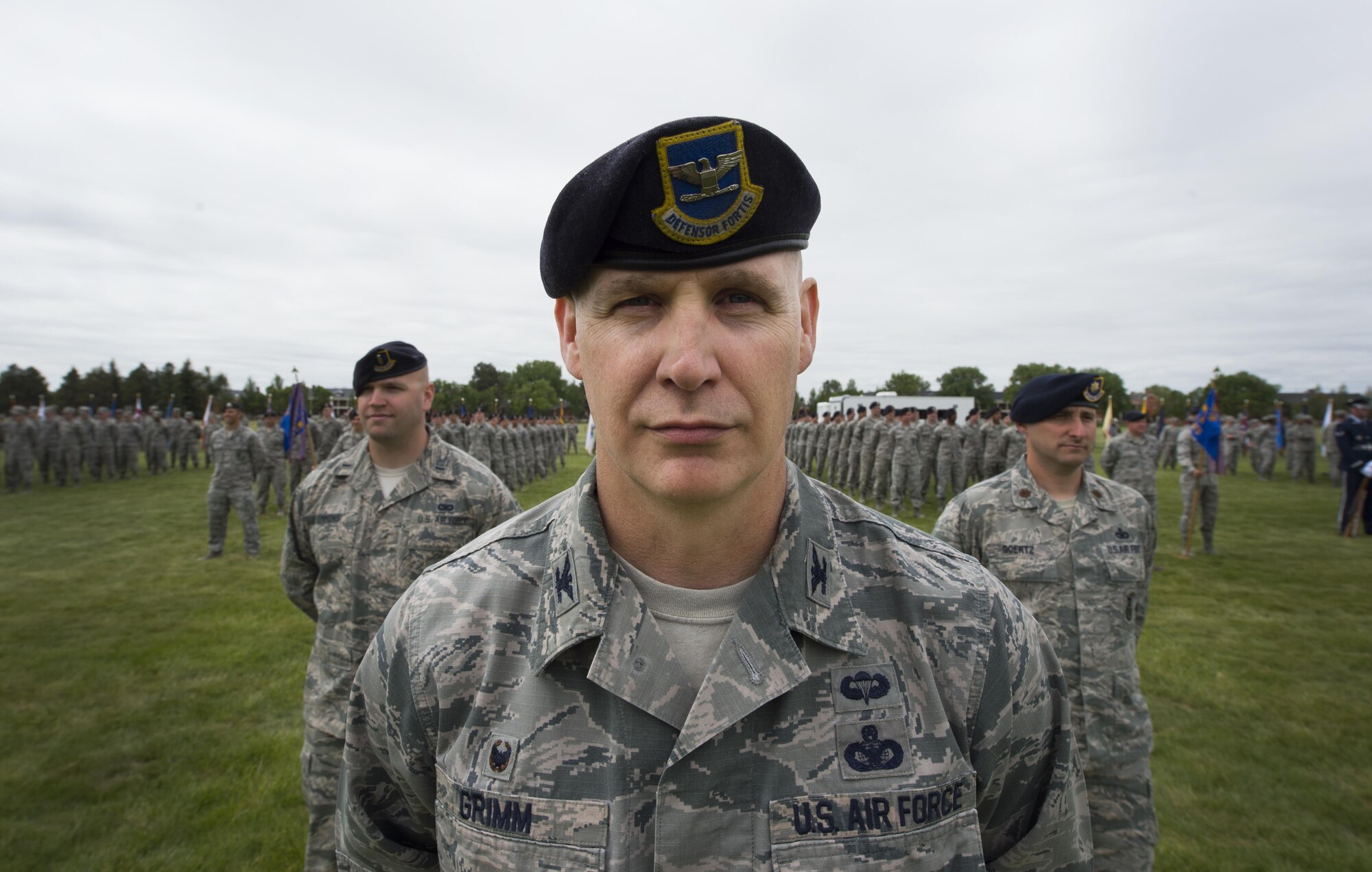 Colonel John Grimm, 90th Security Forces Group commander, stands at parade rest with his group’s formation during the 90th Missile Wing change of command ceremony on the Argonne Parade Field at F.E. Warren Air Force Base, Wyo., June 23, 2017. Grimm leads four squadrons responsible for defending the installation which supports more than 7,000 personnel, a weapons storage area and 150 Minuteman III ICBMs and their related infrastructure spread throughout a 9,600 square-mile area across Wyo., Neb., and Colo. The change of command ceremony signified the transition of command from Col. Stephen Kravitsky to Col. Stacy Huser. (U.S. Air Force photo by Staff Sgt. Christopher Ruano)