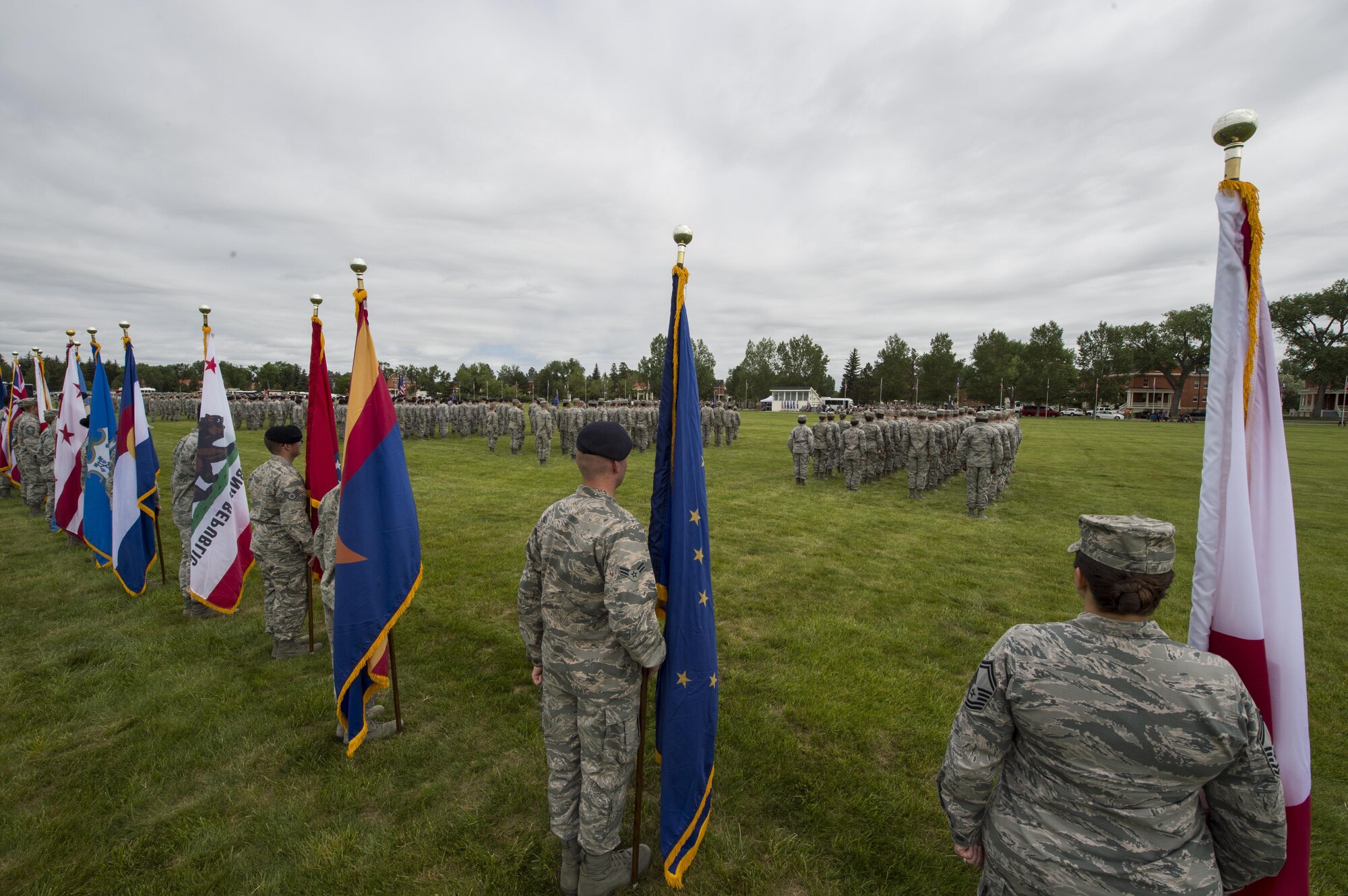 Airmen of the 90th Missile Wing stand in formation during the 90th MW change of command ceremony on the Argonne Parade Field at F.E. Warren Air Force Base, Wyo., June 23, 2017. Members from all four groups within the wing participated in the formation. The change of command ceremony signified the transition of command from Col. Stephen Kravitsky to Col. Stacy Huser. (U.S. Air Force photo by Staff Sgt. Christopher Ruano)


