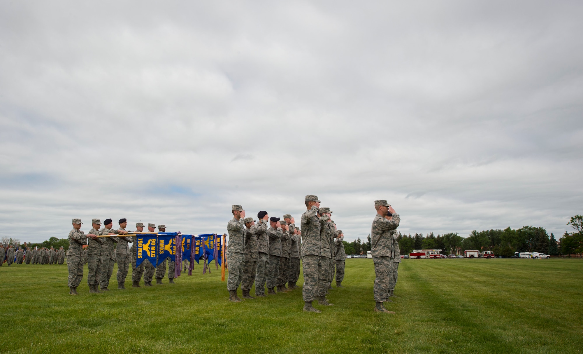 Group and squadron commanders on the parade field render a salute to Maj. Gen. Anthony Cotton, 20th Air Force commander, during the 90th Missile Wing change of command ceremony on the Argonne Parade Field at F.E. Warren Air Force Base, Wyo., June 23, 2017. Cotton was the presiding officer at the change of command ceremony. The event signified the transition of command from Col. Stephen Kravitsky to Col. Stacy Huser. (U.S. Air Force photo by Staff Sgt. Christopher Ruano)