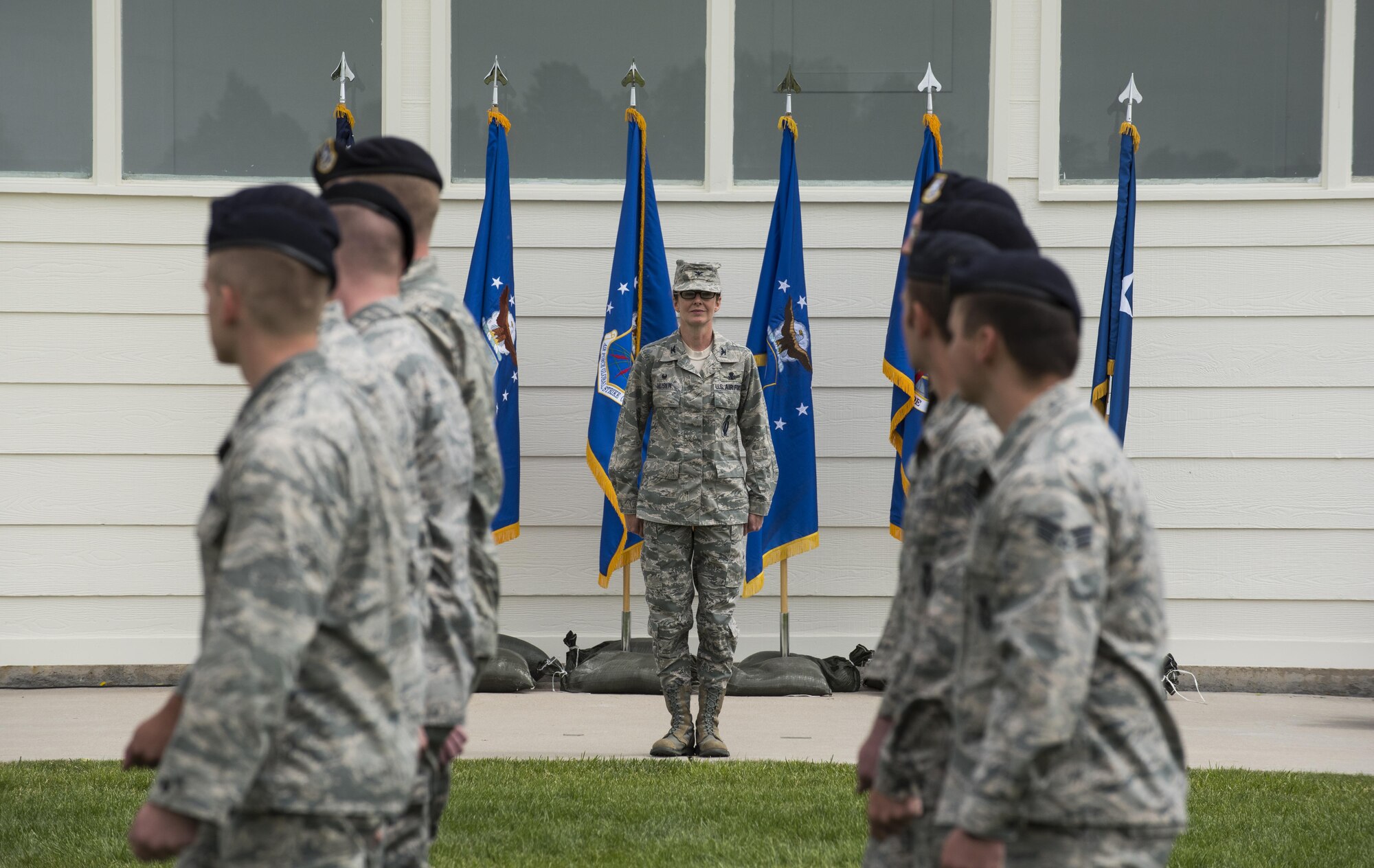 Group formations conduct a pass in review for Col. Stacy Huser, 90th Missile Wing commander, during the 90th MW change of command ceremony on the Argonne Parade Field at F.E. Warren Air Force Base, Wyo., June 23, 2017. A formal parade is a long-standing military tradition that began as a way for a newly-assigned commander to inspect their troops. The ceremony signified the transition of command from Col. Stephen Kravitsky to Huser. (U.S. Air Force photo by Staff Sgt. Christopher Ruano)
