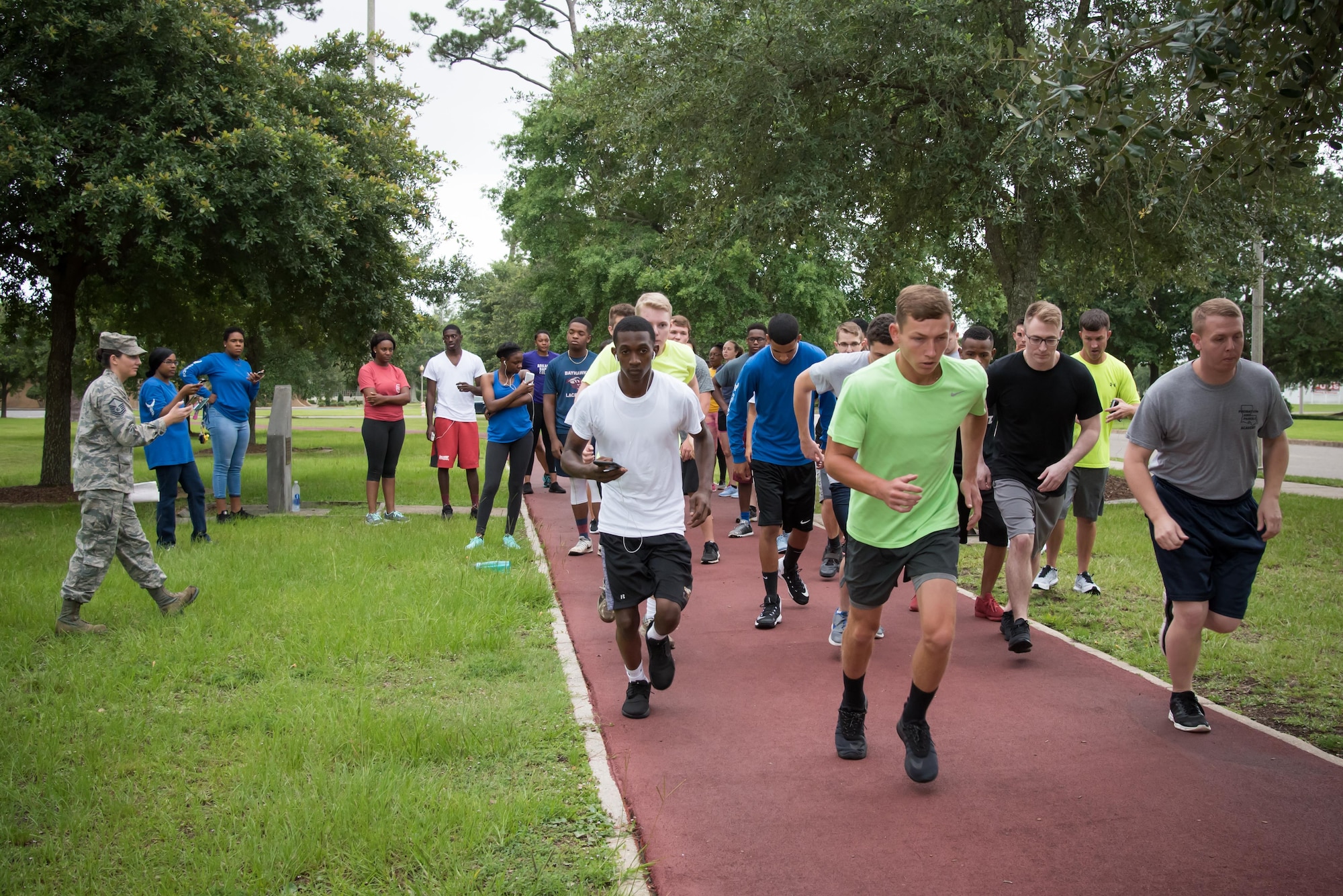 Members of the 403rd Developmental and Training flight practice completing a 1.5 mile run during a physical training session June 3, 2017 at Keesler Air Force Base, Mississippi. (U.S. Air Force photo/Staff Sgt. Heather Heiney)