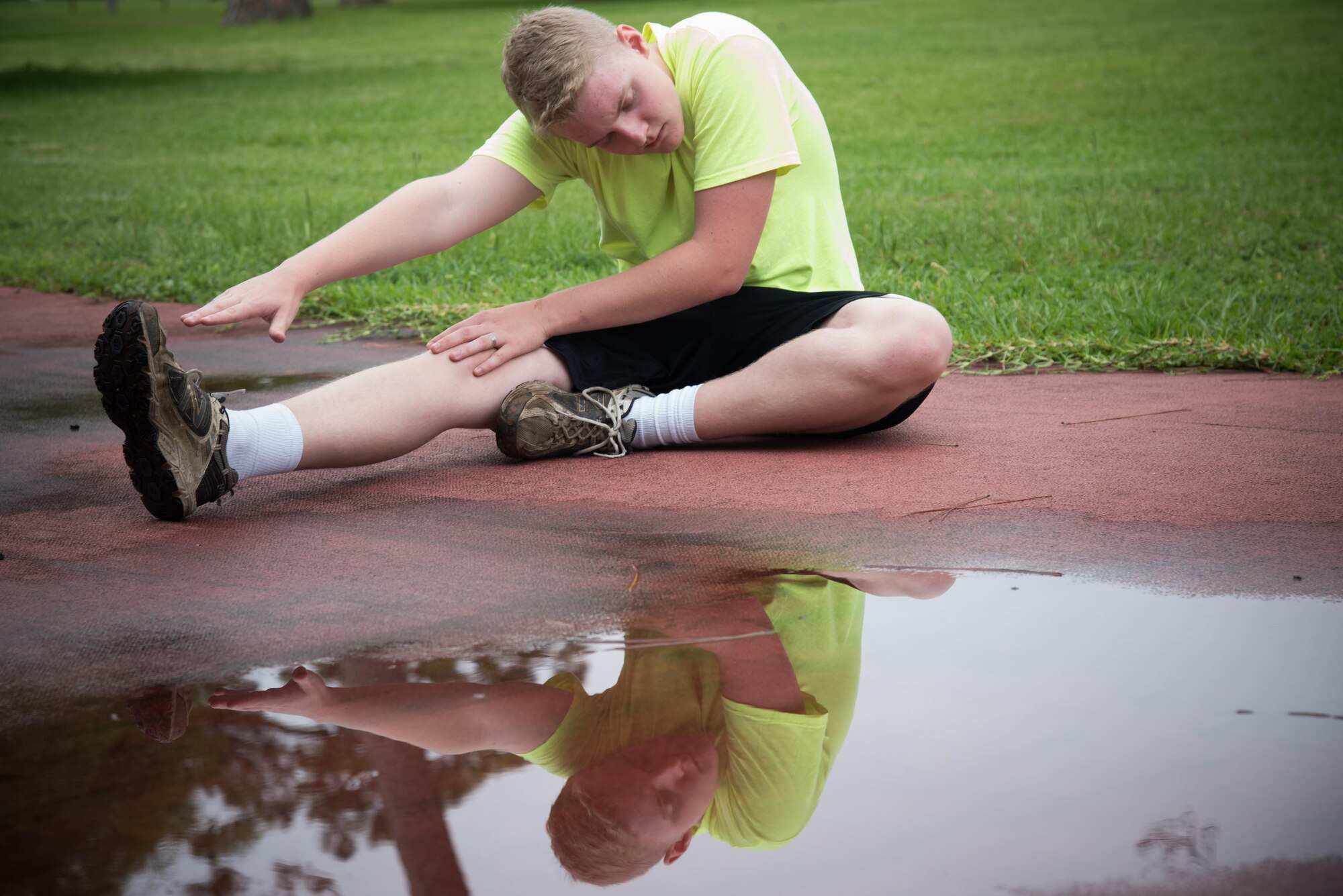 Chad Cristaldi, 403rd Developmental and Training Flight trainee, stretches during a physical training session June 3, 2017 at Keesler Air Force Base, Mississippi. (U.S. Air Force photo/Staff Sgt. Heather Heiney)