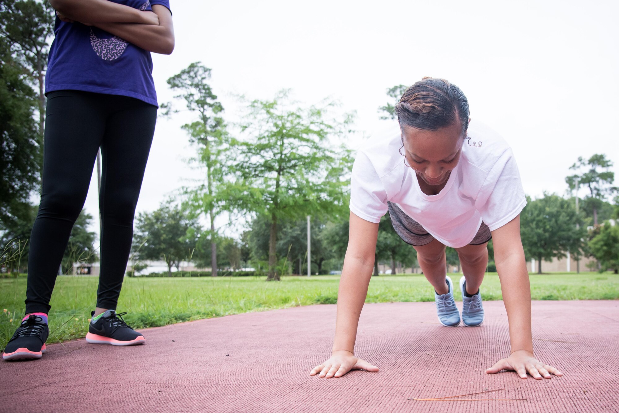 Alexia Melton, 403rd Developmental and Training Flight trainee, practices pushups during a physical training session June 3, 2017 at Keesler Air Force Base, Mississippi. (U.S. Air Force photo/Staff Sgt. Heather Heiney)
