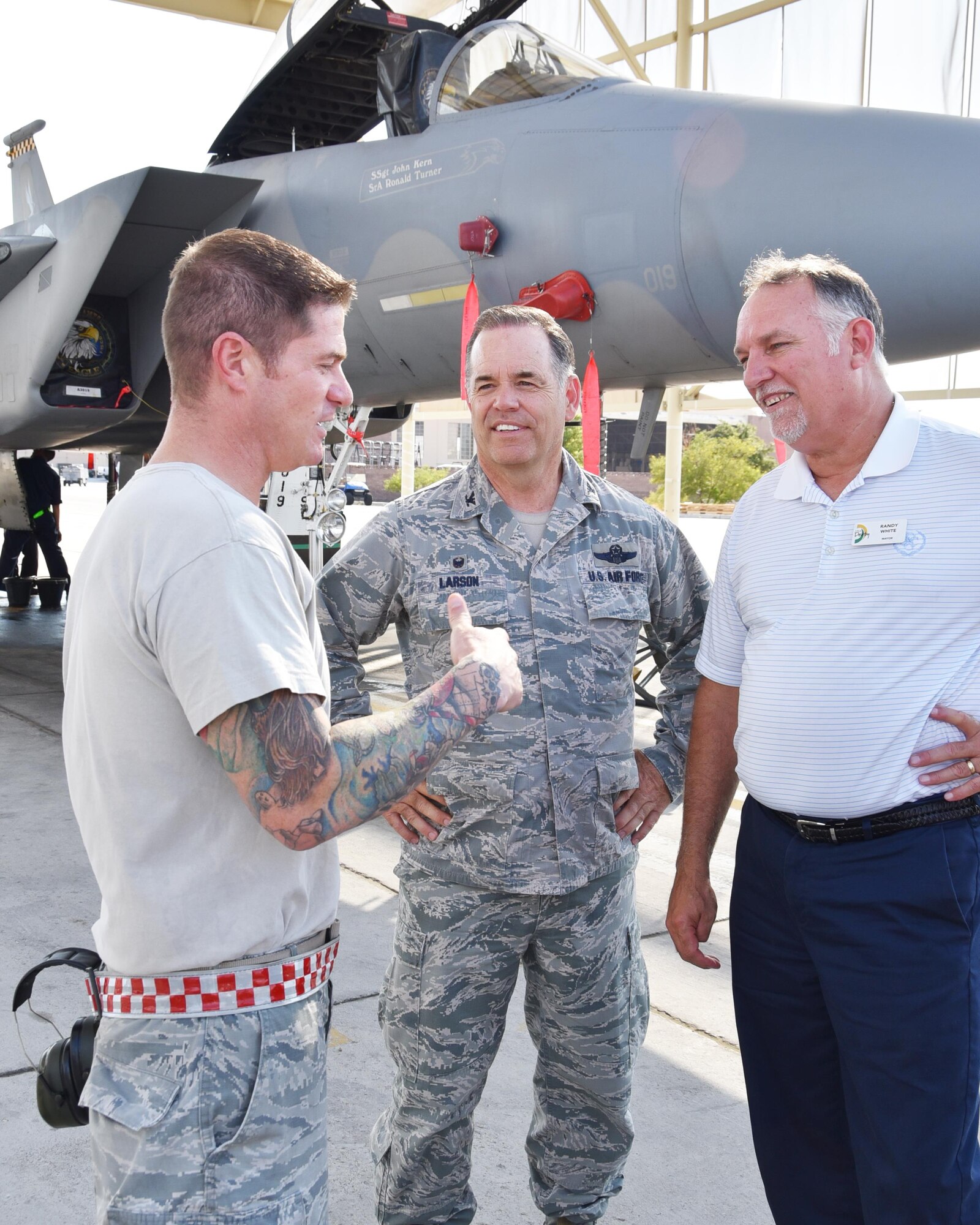 (Left to right) Tech. Sgt. Josh Lake, 757th Aircraft Maintenance Squadron maintainer, and a Derby, Kan., native, speaks to Randy White, the Derby Mayor, , and Col. Mark S. Larson, 931st Air Refueling Wing commander, June 20, 2017, at Nellis Air Force Base, Nev. Twenty civic leaders from Wichita and its surrounding communities boarded a McConnell KC-135 Stratotanker for Nellis to get an up-close look at the “Home of the Fighter Pilot,” and the 99th Air Base Wing.  (U.S. Air Force photo by Tech. Sgt. Abigail Klein)