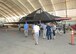 Members of Class 91B of the U.S. Air Force Test Pilot School check out an F-117 Nighthawk in the Air Force Flight Test Museum's restoration hangar during a recent reunion on Edwards Air Force Base. (U.S. Air Force photo by Kenji Thuloweit)