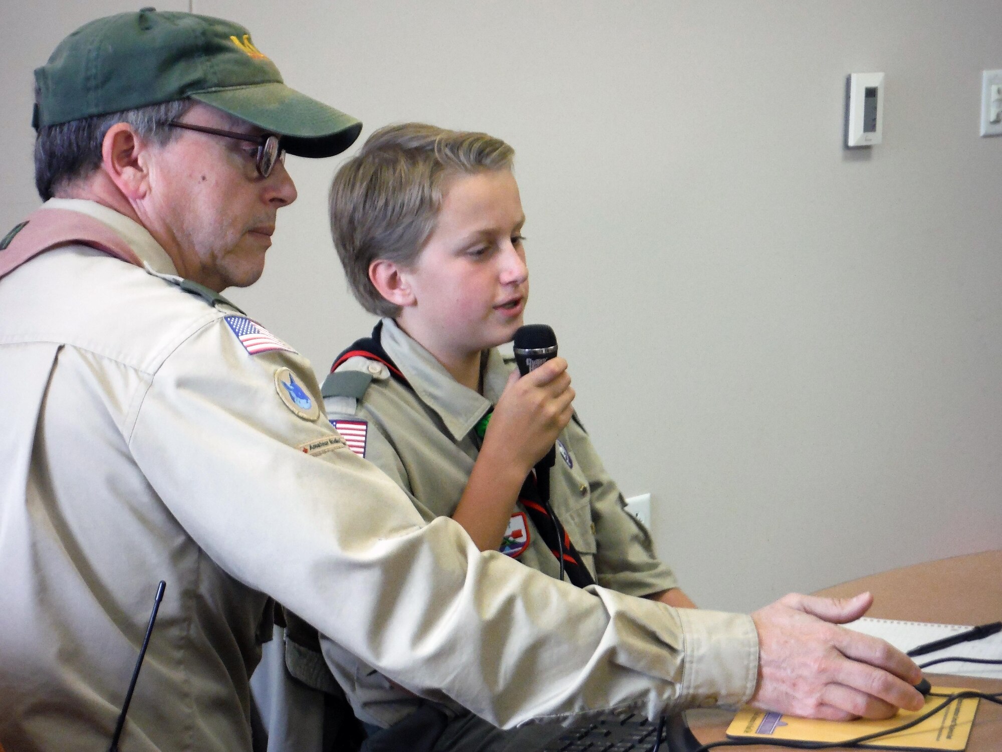 Dudley Allen, 55th Force Support Squadron management analyst, assists a boy scout with radio operations. 