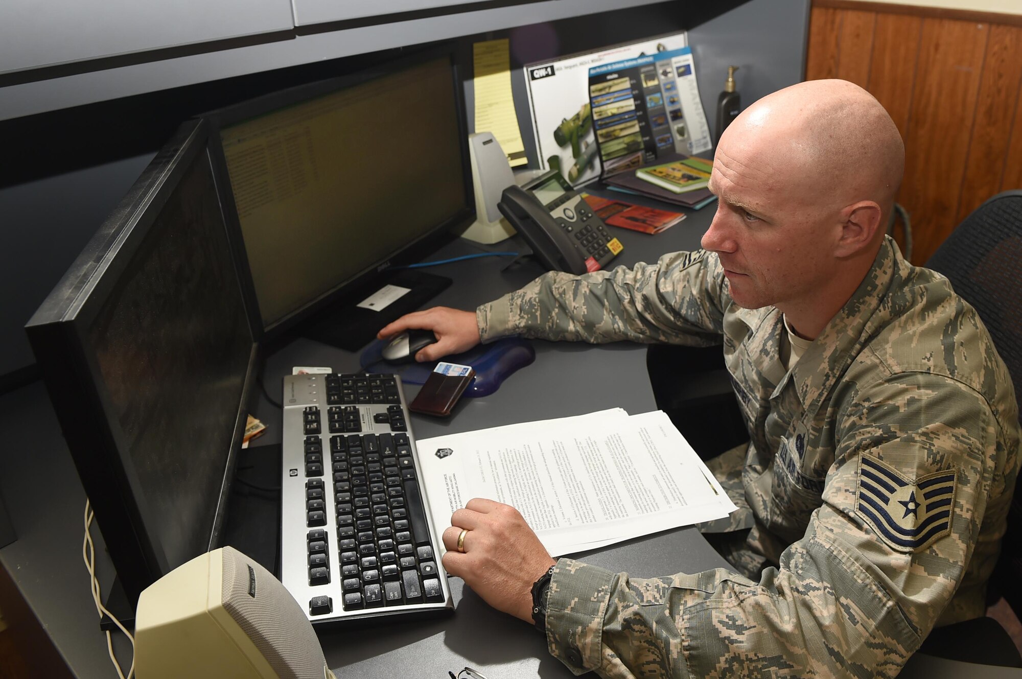 U.S. Air Force Tech. Sgt. Bob Willoughby, 97th Security Forces Squadron anti-terrorism program manager, verifies that Airmen trying to travel outside of the country are completing proper procedures, June 22, 2017 at Altus AFB, Oklahoma.  The Anti-Terrorism Office handles anything relating to terrorism and security vulnerabilities and aims to stop terrorist related activity before it is able to be planned and executed.