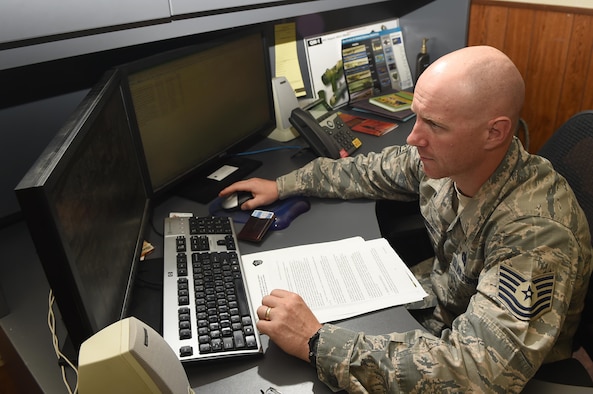 U.S. Air Force Tech. Sgt. Bob Willoughby, 97th Security Forces Squadron anti-terrorism program manager, verifies that Airmen trying to travel outside of the country are completing proper procedures, June 22, 2017 at Altus AFB, Oklahoma.  The Anti-Terrorism Office handles anything relating to terrorism and security vulnerabilities and aims to stop terrorist related activity before it is able to be planned and executed.