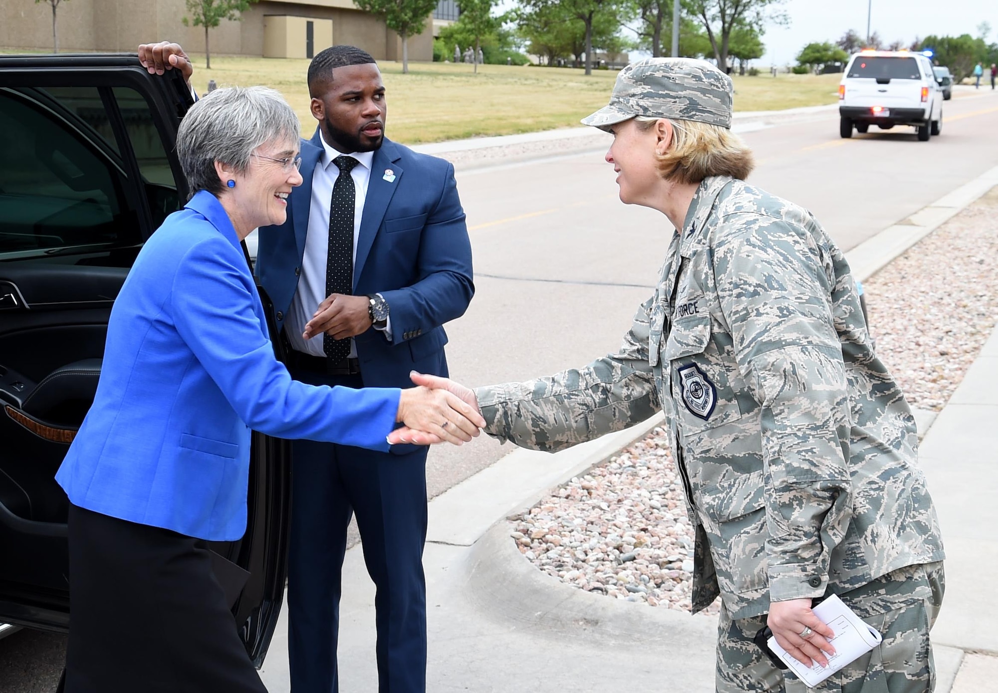 Secretary of the Air Force, Dr. Heather Wilson, shakes hands with Col. DeAnna Burt, 50th Space Wing commander during her visit to Schriever Air Force Base, Colorado, Friday, June 23, 2017. The visit marked the second time the Air Force’s top ranking official has visited Schriever since her appointment as secretary in May. Wilson accompanied Vice President Mike Pence during the visit, marking the first time a vice president has visited Schriever. (U.S. Air Force photo/Staff Sgt. Wes Wright)