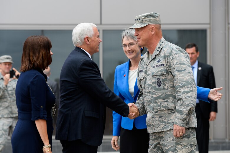 Vice President Mike Pence shakes hands with Gen. John Raymond, Air Force Space Command commander, while Secretary of the Air Force Heather Wilson looks on during his visit to the 50th Space Wing visit at Schriever Air Force Base, Colo., Friday, June 22, 2017. Vice President Pence was given an orientation on space operations following the current administration’s re-establishment of the National Space Council.     (U.S. Air Force photo/Christopher DeWitt)