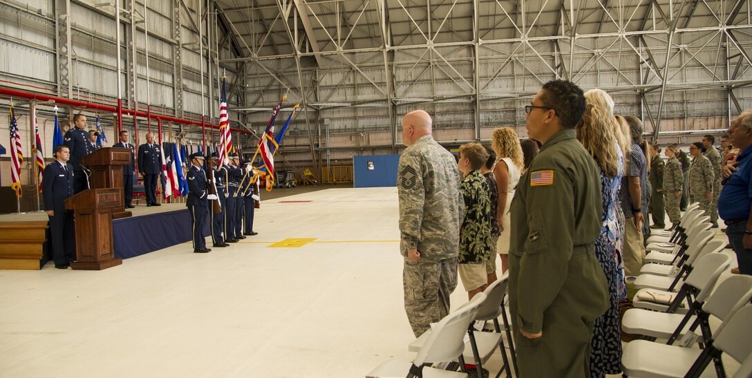 Members of the Honor Guard post the colors for the National Anthem and the Hawaii Pono'i during the 15th Operations Group Change of Command Ceremony, Joint Base Pearl Harbor-Hickam, Hawaii, June 22, 2017. The 15th Operations Group oversees operations at the largest joint-use airflield in the U.S., executes global combat and peace time operations, and provides executive airlift for senior military leaders.  (U.S. photo by Tech. Sgt. Heather Redman)