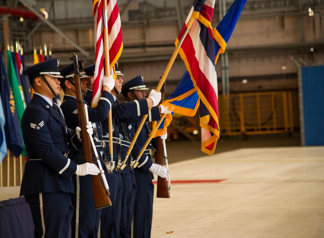 Members of the Honor Guard post the colors for the National Anthem and the Hawaii Pono'i during the 15th Operations Group Change of Command Ceremony, Joint Base Pearl Harbor-Hickam, Hawaii, June 22, 2017. The 15th Operations Group oversees operations at the largest joint-use airflield in the U.S., executes global combat and peace time operations, and provides executive airlift for senior military leaders.  (U.S. photo by Tech. Sgt. Heather Redman)