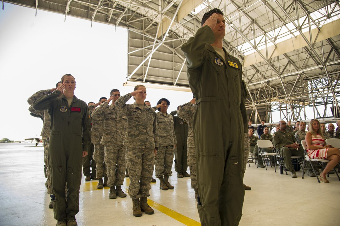 The men and women of the 15th Operations Group give their first salute to Col. Jason King, 15th Operations Group commander, during the 15th Operations Group Change of Command Ceremony, Joint Base Pearl Harbor-Hickam, Hawaii, June 22, 2017. The 15th Operations Group oversees operations at the largest joint-use airflield in the U.S., executes global combat and peace time operations, and provides executive airlift for senior military leaders.  (U.S. photo by Tech. Sgt. Heather Redman)