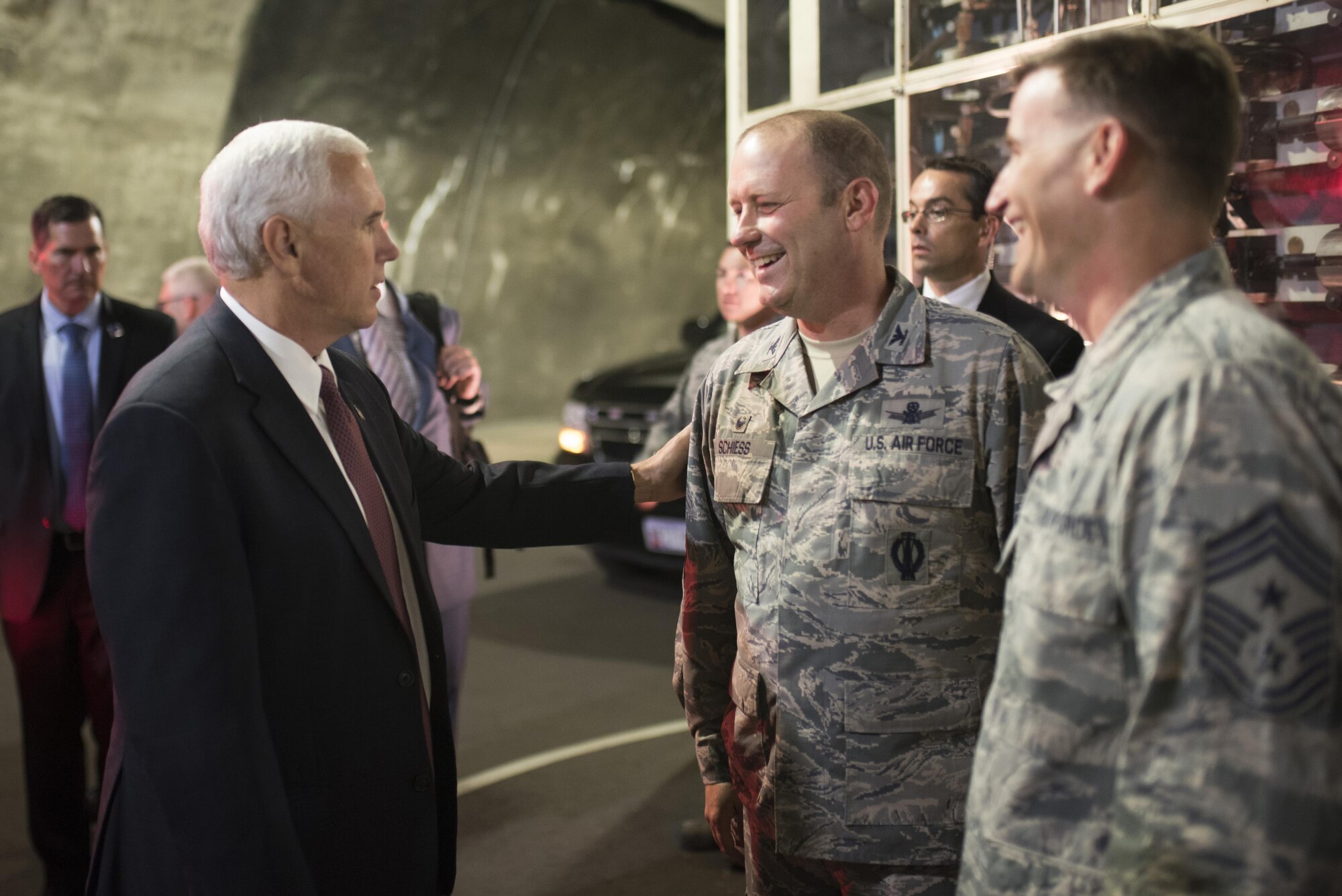 CHEYENNE MOUNTAIN AIR FORCE STATION, Colo. - Vice President Mike Pence
speaks with Col. Doug Schiess, 21st Space Wing commander, and Chief Master
Sgt. Mark Bronson, 21st SW command chief, during his visit to Cheyenne
Mountain Air Force Station, Colo., June 23, 2017.  It has been 34 years
since the last visit by the vice president of the United States. (U.S. Air
Force photo by Senior Airman Dennis Hoffman)