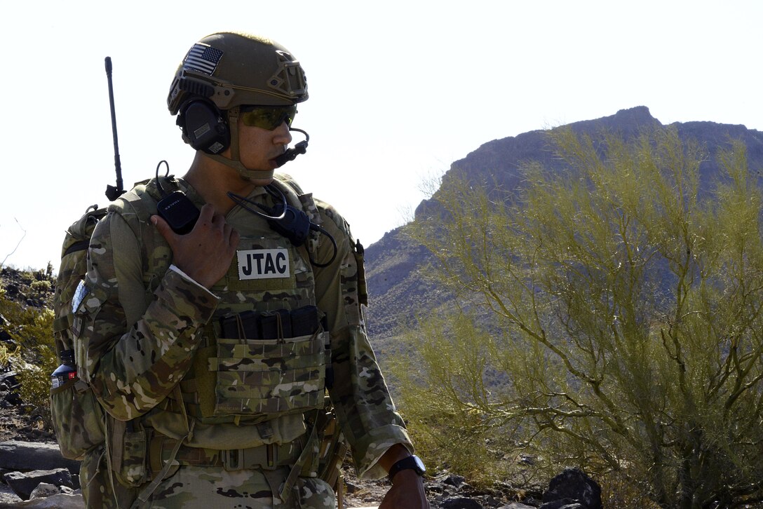 Airman 1st Class Anthony Butler, 10th Air Support Operations Squadron joint terminal attack controller, speaks to aircrew during training, June 22, 2017, at Barry M. Goldwater Range, Ariz. Communication between pilots and JTACs is verified between both parties, ensuring the correct target is identified and struck. (U.S. Air force photo/Staff Sgt. Trevor Rhynes)