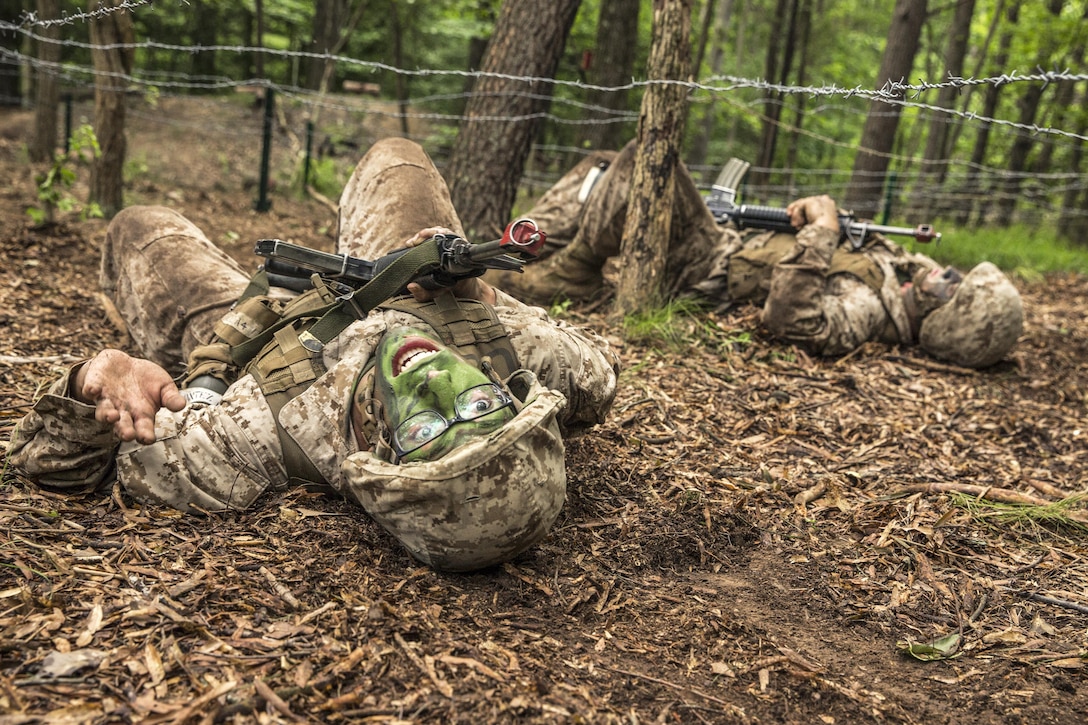 Marine Corps officer candidates participate in a fire team assault course at the Officer Candidate School at Marine Corps Base Quantico, Va., June 17, 2017. Candidates must go successfully complete three months of intensive training for commissioning as an officer. Marine Corps photo by Lance Cpl. Cristian L. Ricardo