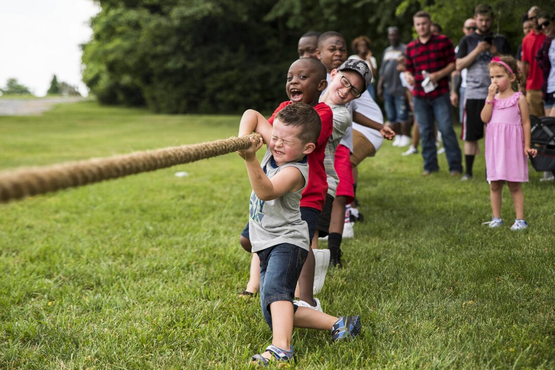 Children of Naval Support Activity Bethesda personnel compete in tug of war in Clarksburg, Md., June 17, 2017, during the activity’s first command picnic. Navy photo by Petty Officer 2nd Class William Phillips