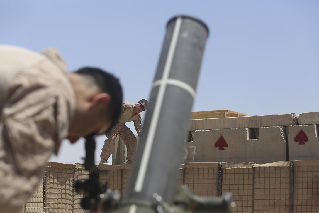 Marines with Task Force Southwest conduct refer realign procedures on the 120mm mortar prior to a live-fire registration mission at Camp Shorab, Afghanistan, June 23, 2017. The event ensured functionality and the proper registration for 120mm mortar targets integrated into the base defense plan. (U.S. Marine Corps photo by Sgt. Lucas Hopkins)