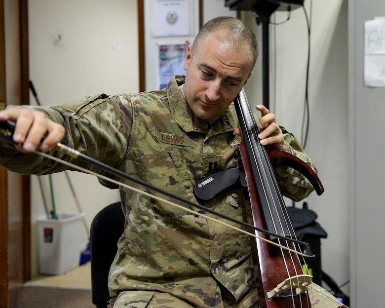 U.S. Air Force Capt. Justin Lewis, Officer in Charge and cellist assigned to the Air Force Central Command Band, practices cello in preparation for a concert at Al Udeid, Air Force Base, Qatar, May 25, 2017. The AFCENT Band, stationed at Al Udeid, travels throughout the Central Command Area of Responsibility in support of building partnerships, boosting morale, and providing diplomacy and outreach to host nation communities. (U.S. Air Force photo by Tech. Sgt. Bradly A. Schneider/Released)