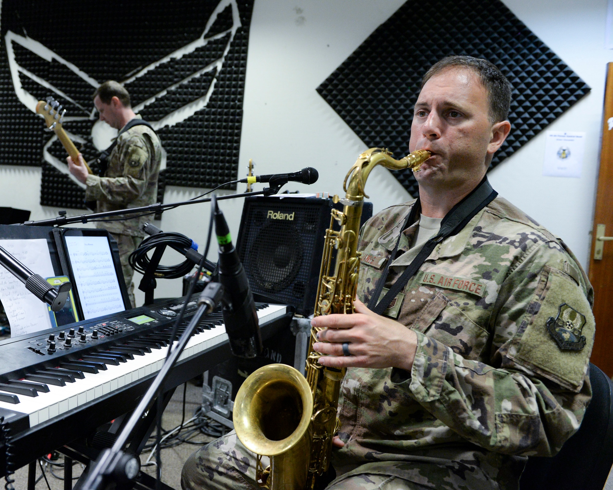 U.S. Air Force Tech. Sgt. Ryan Janus, keyboard player and saxophonist assigned to the Air Force Central Command Band, practices saxophone in preparation for a concert at Al Udeid, Air Force Base, Qatar, May 25, 2017. The AFCENT Band, stationed at Al Udeid, travels throughout the Central Command Area of Responsibility in support of building partnerships, boosting morale, and providing diplomacy and outreach to host nation communities. (U.S. Air Force photo by Tech. Sgt. Bradly A. Schneider/Released)
