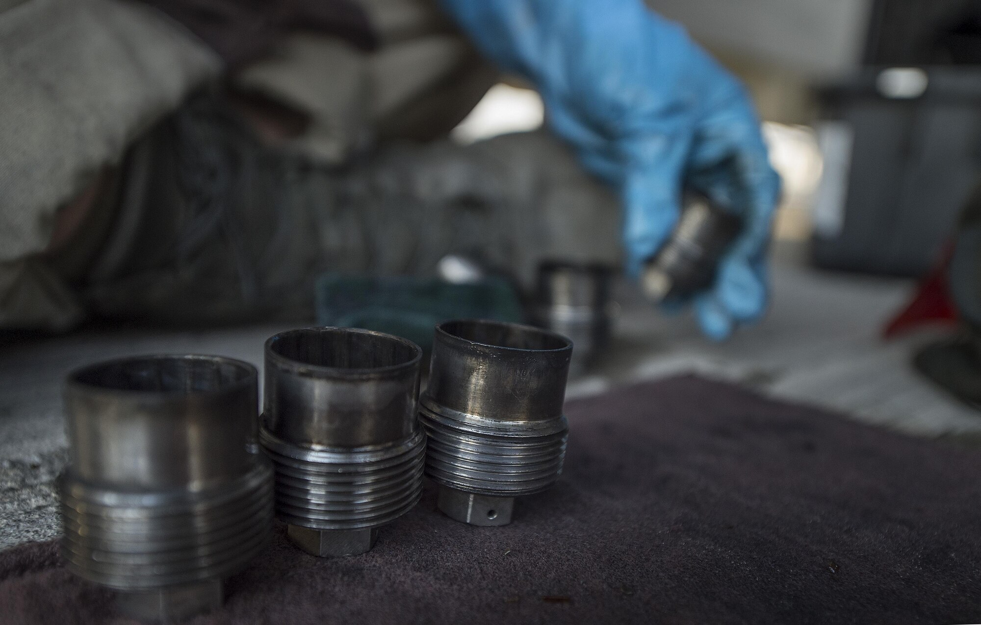 A munitions technician, assigned to the 23rd Expeditionary Aircraft Maintenance Unit, cleans ammunition parts before loading munitions on a B-52 Stratofortress assigned to the 23rd Expeditionary Bomb Squadron at an undisclosed location in Southwest Asia, June 15, 2017. The 23rd EAMU provided the 400th consecutive sortie without a maintenance cancellation on the day the 23rd EBS celebrated the 100th anniversary of the unit. (U.S. Air Force photo by Staff Sgt. Trevor T. McBride) 