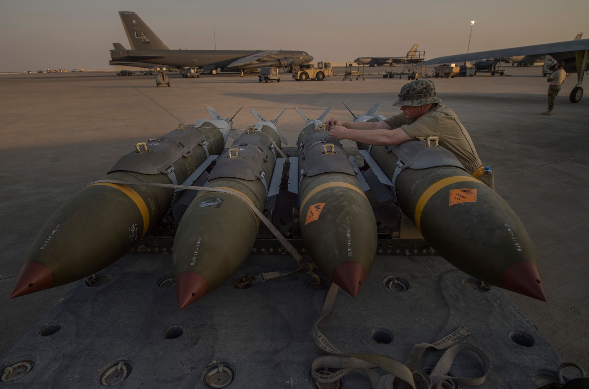 A munitions technician, assigned to the 23rd Expeditionary Aircraft Maintenance Unit, prepares to load munitions on a B-52 Stratofortress assigned to the 23rd Expeditionary Bomb Squadron at an undisclosed location in Southwest Asia, June 15, 2017. The 23rd EAMU provided the 400th consecutive sortie without a maintenance cancellation on the day the 23rd EBS celebrated the 100th anniversary of the unit. (U.S. Air Force photo by Staff Sgt. Trevor T. McBride) 
