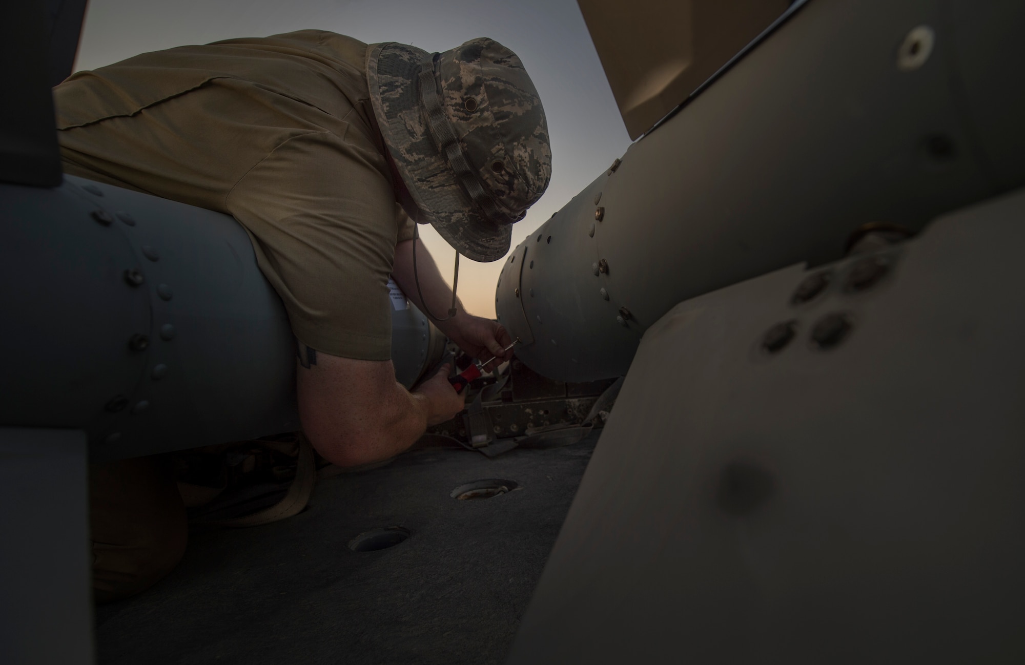 A munitions technician, assigned to the 23rd Expeditionary Aircraft Maintenance Unit, prepares to load munitions on a B-52 Stratofortress assigned to the 23rd Expeditionary Bomb Squadron at an undisclosed location in Southwest Asia, June 15, 2017. The 23rd EAMU provided the 400th consecutive sortie without a maintenance cancellation on the day the 23rd EBS celebrated the 100th anniversary of the unit. (U.S. Air Force photo by Staff Sgt. Trevor T. McBride) 
