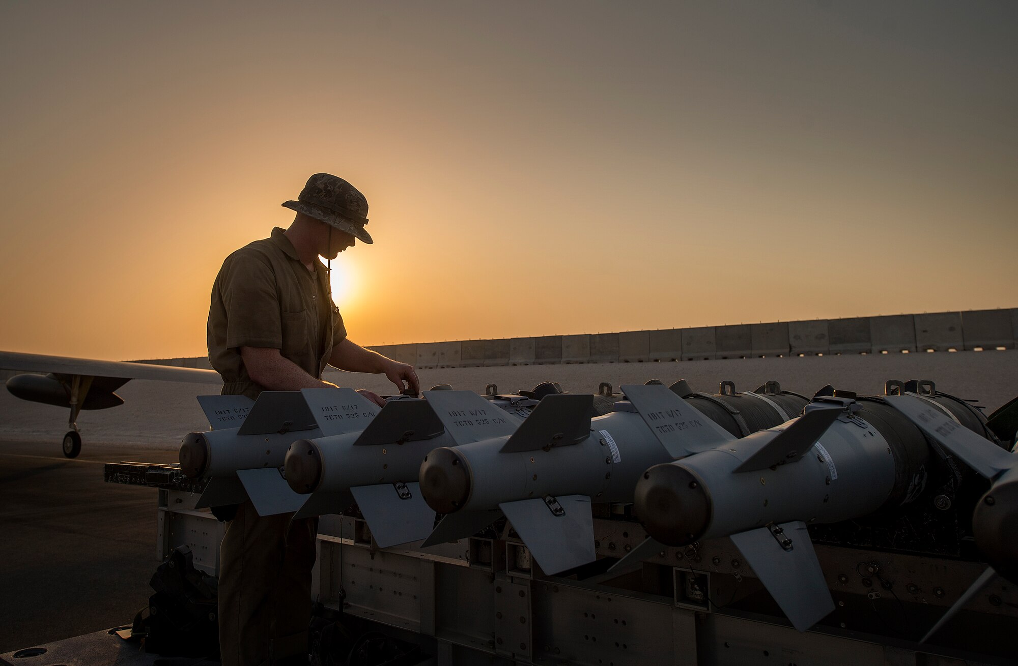 A munitions technician, assigned the 23rd Expeditionary Aircraft Maintenance Unit, prepares to load munitions on a B-52 Stratofortress assigned to the 23rd Expeditionary Bomb Squadron at an undisclosed location in Southwest Asia, June 15, 2017. The 23rd EAMU provided the 400th consecutive sortie without a maintenance cancellation on the day the 23rd EBS celebrated the 100th anniversary of the unit. (U.S. Air Force photo by Staff Sgt. Trevor T. McBride) 
