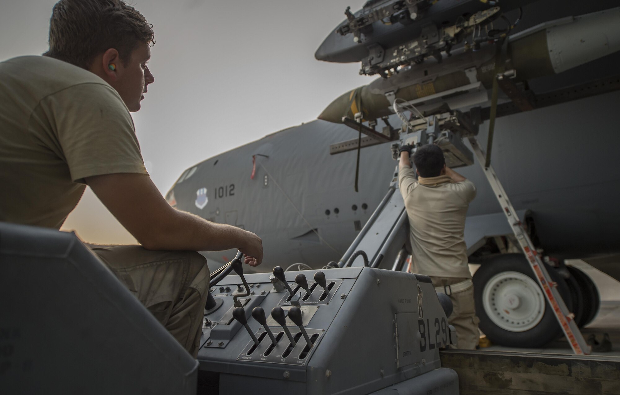 Three 23rd Expeditionary Aircraft Maintenance Unit munitions technicians load munitions on a B-52 Stratofortress at an undisclosed location in Southwest Asia, June 15, 2017. The 23rd EAMU provided the 400th consecutive sortie without a maintenance cancellation on the day the 23rd Expeditionary Bomb Squadron celebrated the 100th anniversary of the unit. (U.S. Air Force photo by Staff Sgt. Trevor T. McBride) 
