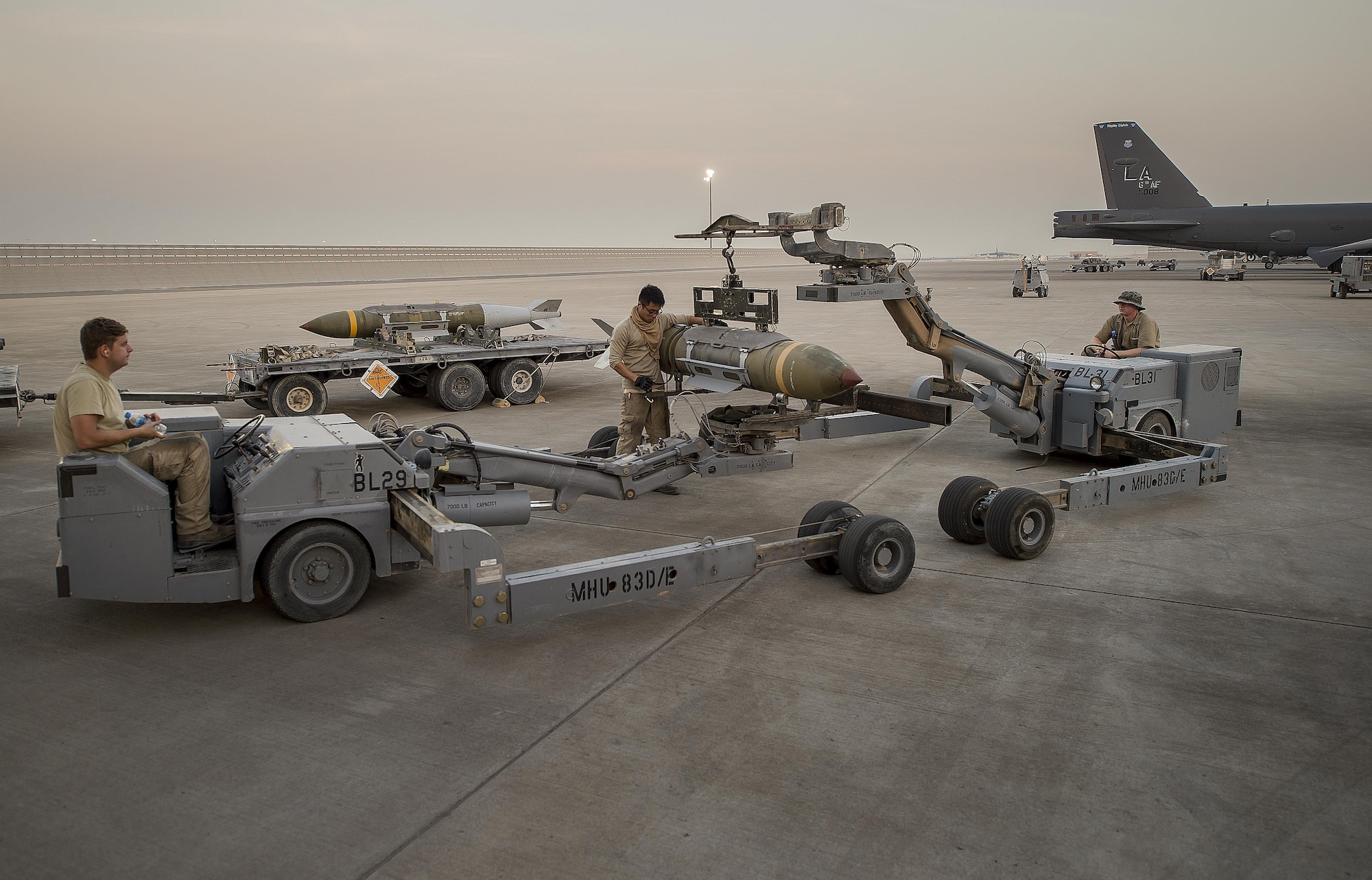 Three 23rd Expeditionary Aircraft Maintenance Unit munitions technicians load munitions on a B-52 Stratofortress at an undisclosed location in Southwest Asia, June 15, 2017. The 23rd EAMU provided the 400th consecutive sortie without a maintenance cancellation on the day the 23rd Expeditionary Bomb Squadron celebrated the 100th anniversary of the unit. (U.S. Air Force photo by Staff Sgt. Trevor T. McBride) 