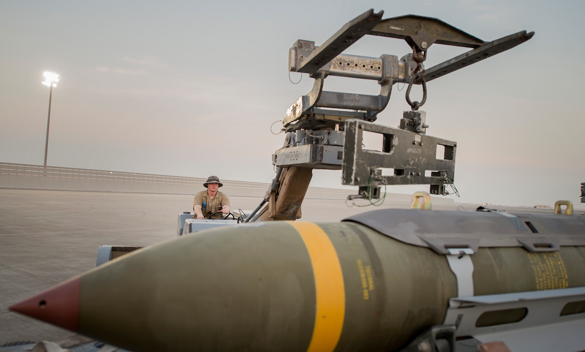 A munitions technician, assigned the 23rd Expeditionary Aircraft Maintenance Unit, prepares to load munitions on a B-52 Stratofortress at an undisclosed location in Southwest Asia, June 15, 2017. The 23rd EAMU provided the 400th consecutive sortie without a maintenance cancellation on the day the 23rd Expeditionary Bomb Squadron celebrated the 100th anniversary of the unit. (U.S. Air Force photo by Staff Sgt. Trevor T. McBride) 
