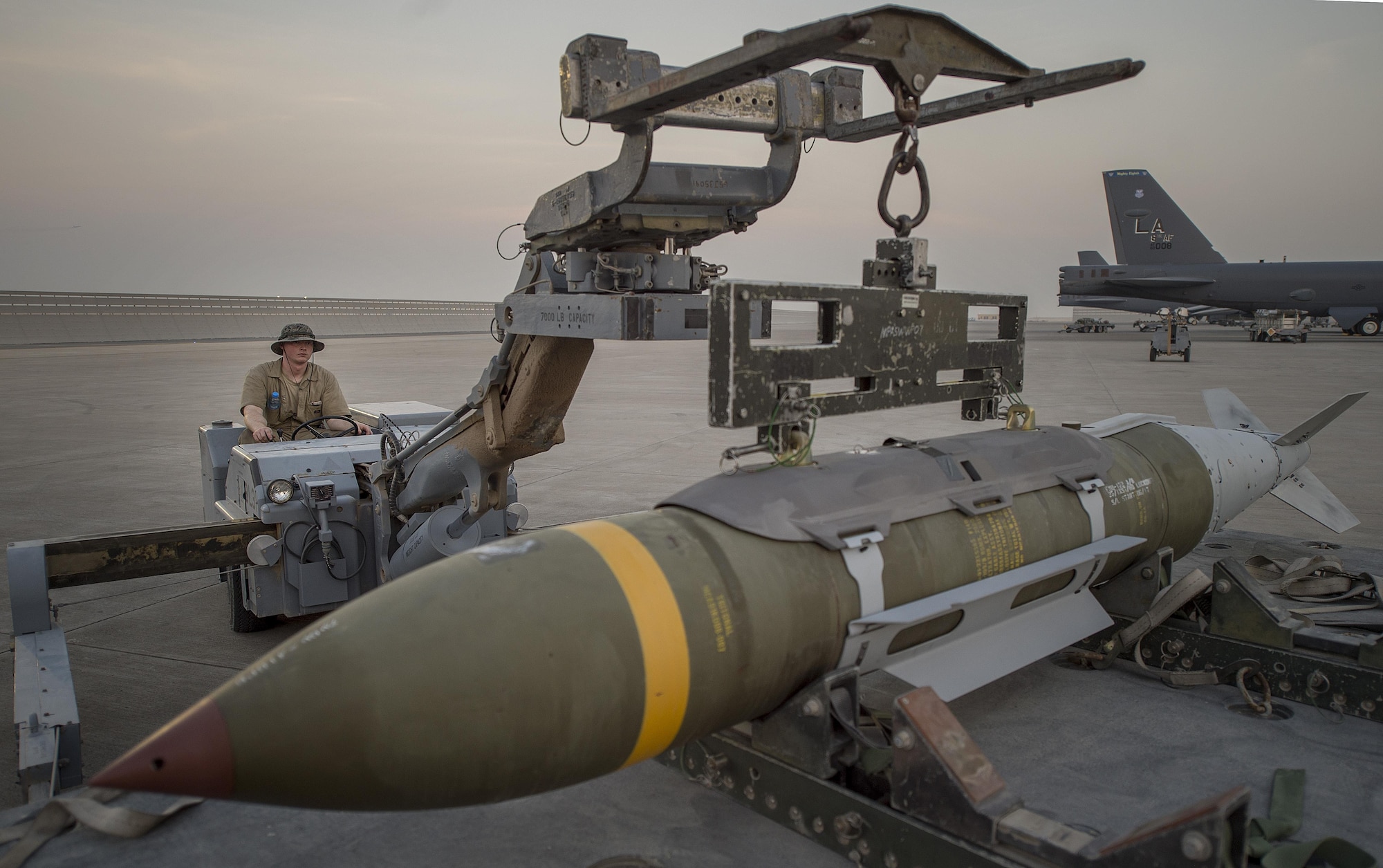 A munitions technician, assigned the 23rd Expeditionary Aircraft Maintenance Unit, prepares to load munitions on a B-52 Stratofortress at an undisclosed location in Southwest Asia, June 15, 2017. The 23rd EAMU provided the 400th consecutive sortie without a maintenance cancellation on the day the 23rd Expeditionary Bomb Squadron celebrated the 100th anniversary of the unit. (U.S. Air Force photo by Staff Sgt. Trevor T. McBride) 
