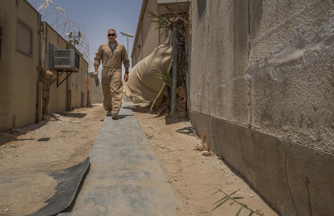 A B-52 Stratofortress pilot, assigned to the 23rd Expeditionary Bomb Squadron, walks from the base armory before a flight at an undisclosed location in Southwest Asia, June 16, 2017. The 23rd EBS conducted the 400th consecutive sortie without a maintenance cancellation on the day the unit celebrated its 100th anniversary. (U.S. Air Force photo by Staff Sgt. Trevor T. McBride
