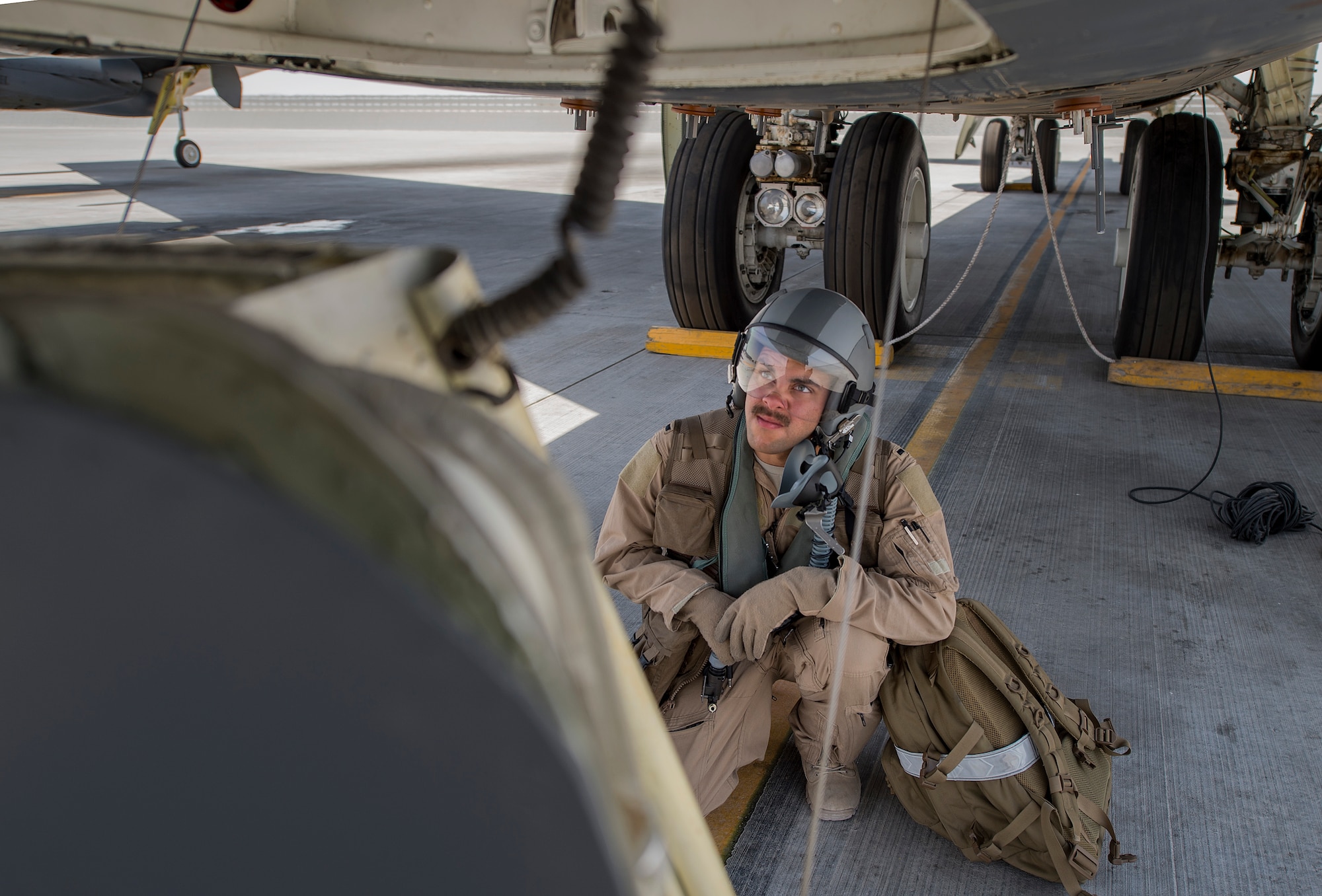 A B-52 Stratofortress pilot, assigned to the 23rd Expeditionary Bomb Squadron, waits to board the aircraft before a flight at an undisclosed location in Southwest Asia, June 16, 2017. The 23rd EBS conducted the 400th consecutive sortie without a maintenance cancellation on the day the unit celebrated its 100th anniversary. (U.S. Air Force photo by Staff Sgt. Trevor T. McBride) 