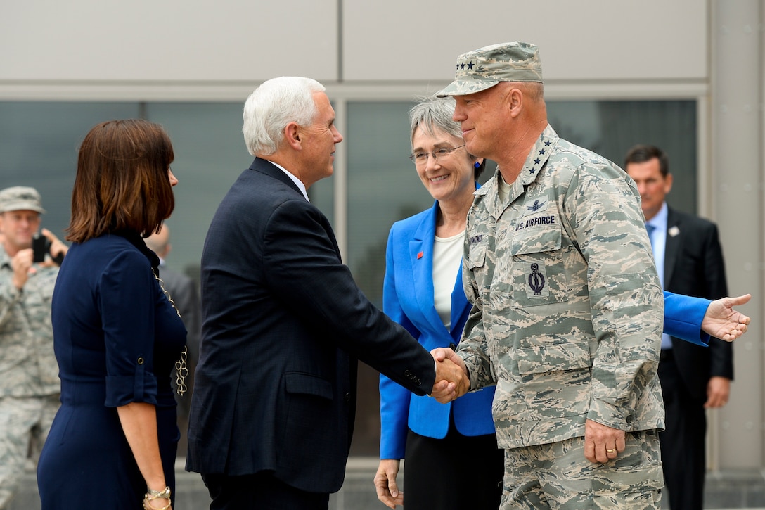 Vice President Mike Pence shakes hands with Air Force Gen. Jay Raymond, commander of Air Force Space Command, while Air Force Secretary Heather Wilson and Pence's wife, Karen Pence, look on at Schriever Air Force Base, Colo., June 22, 2017. Air Force photo by Christopher DeWitt