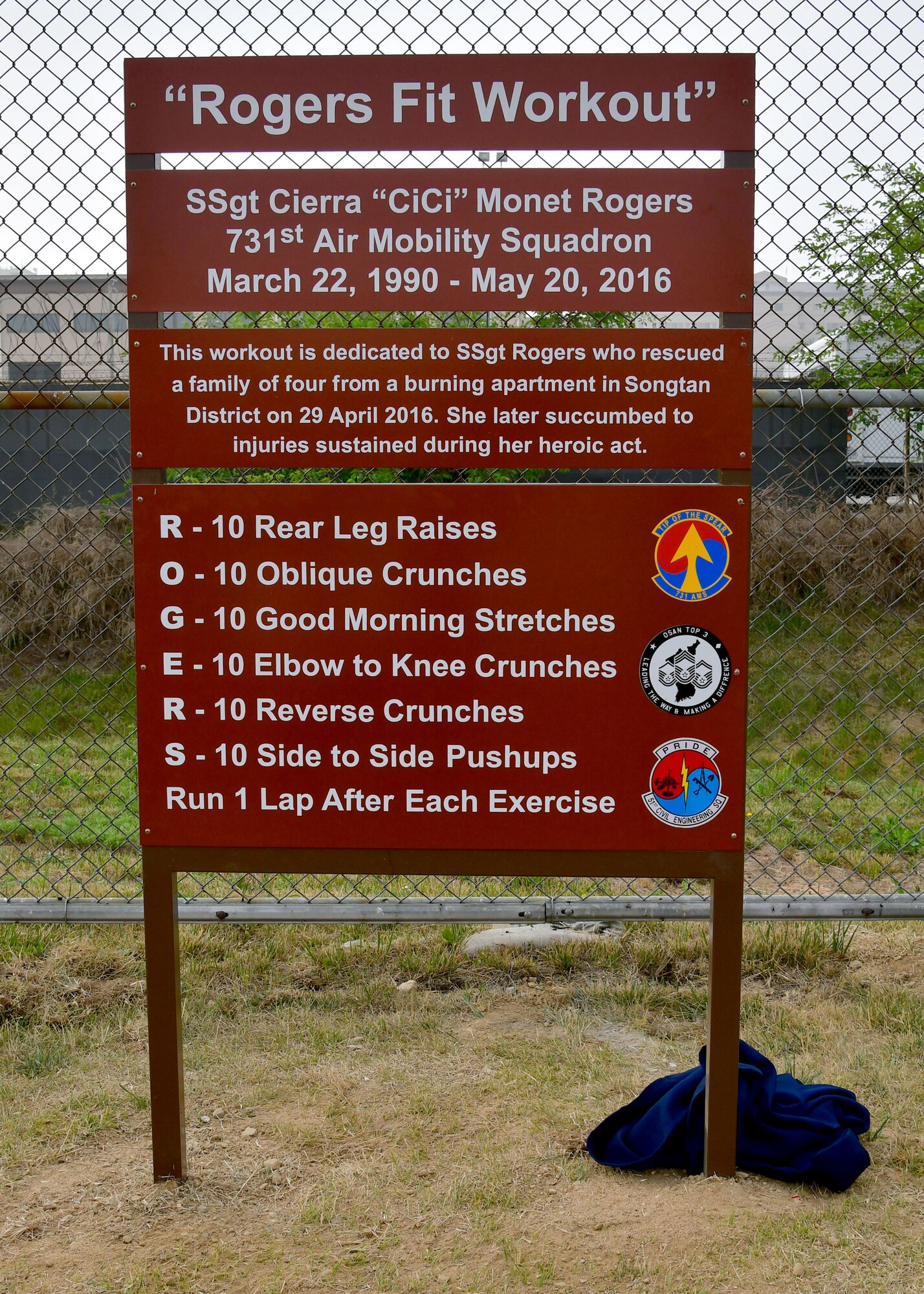 The “Rogers Fit Workout” memorial is unveiled at the Mustang Running Track June 23, 2017 at Osan AB, Republic of Korea. The 731st Air Mobility Squadron along with the Osan Top Three Heritage Committee and the 51st Force Support Squadron Fitness Staff unveiled the memorial and hosted the “Rogers Fit Workout” challenge in honor of U.S. Air Force Staff Sgt. Cierra Rogers, who has passed away May 20, 2016, due to injuries she sustained from helping a family escape a burning apartment building. (U.S. Air Force photo by Senior Airman Franklin R. Ramos/Released)