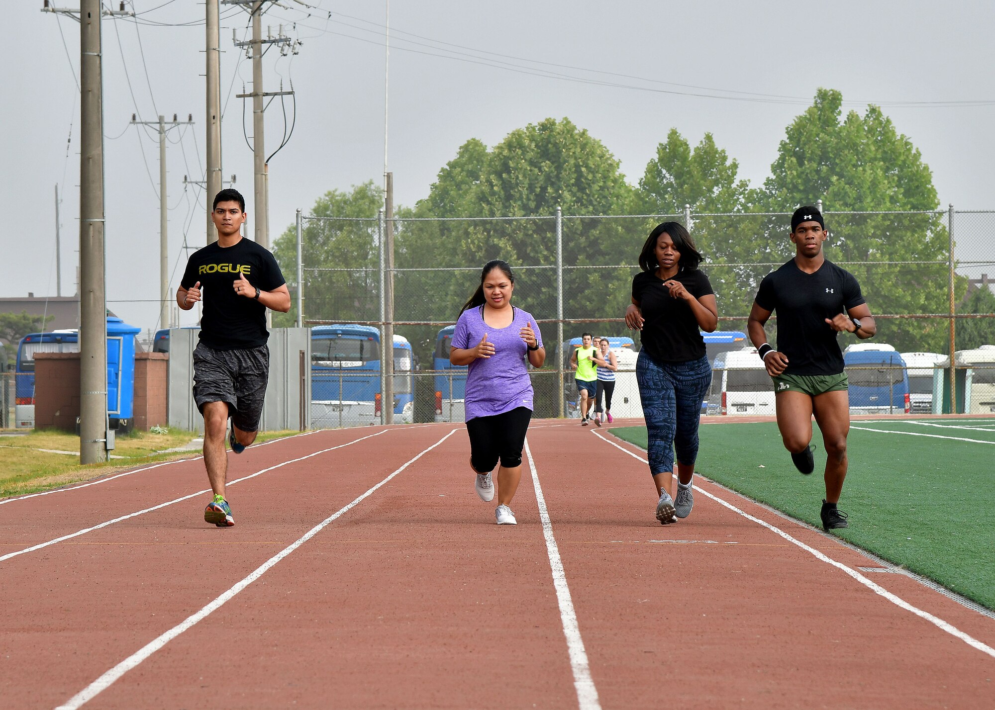 Members of Osan Air Base run on the track during the “Rogers Fit Workout” challenge June 23, 2017 at Osan AB, Republic of Korea. The 731st AMS along with the Osan Top Three Heritage Committee and the 51st Force Support Squadron Fitness Staff unveiled a memorial and hosted the “Rogers Fit Workout” challenge in honor of Rogers, who has passed away May 20, 2016, due to injuries she sustained from helping a family escape a burning apartment building. (U.S. Air Force photo by Senior Airman Franklin R. Ramos/Released)