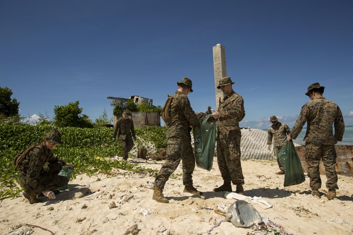 BETIO ISLAND, TARAWA ATOLL, KIRIBATI— Marines and Sailors with Task Force Koa Moana 17 pick up trash during a beach cleanup, June 16, 2017, on Betio Island, Tarawa Atoll, Kiribati. The cleanup took place during a week of training where Marines and Sailors trained and shared ideas with the Kiribati Police Maritime Unit to develop a more capable, well-rounded police force. (U.S. Marine Corps photo by Sgt. Douglas D. Simons)