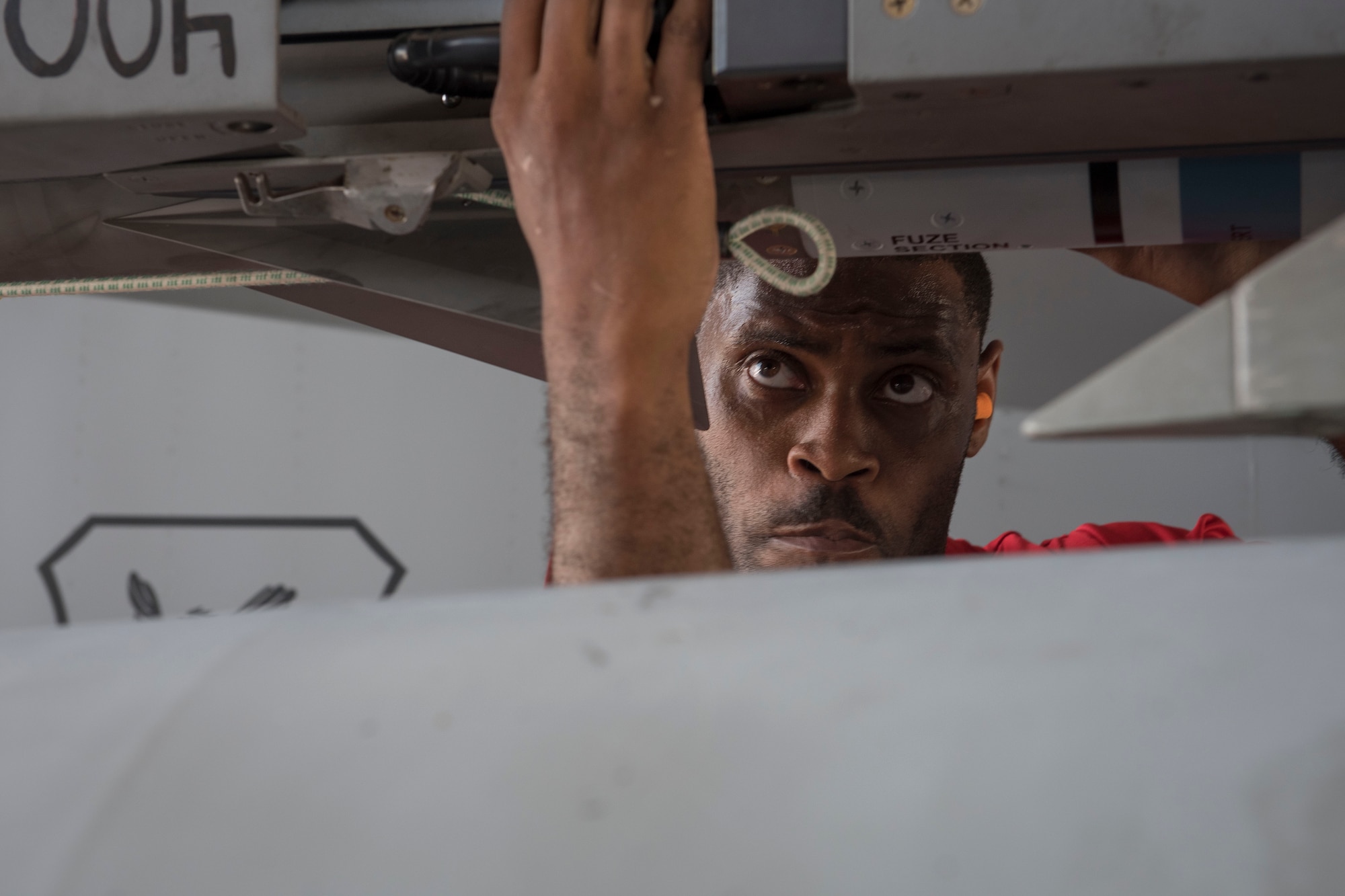 U.S. Air Force Staff Sgt. Jason Jones, 67th Aircraft Maintenance Unit weapons load team lead crew chief, inspects an F-15 Eagle during a quarterly weapons load competition June 23, 2017, at Kadena Air Base, Japan. The competition evaluated safety, reliability and effectiveness while adhering to technical data and explosive safety. (U.S. Air Force photo by Senior Airman John Linzmeier)
