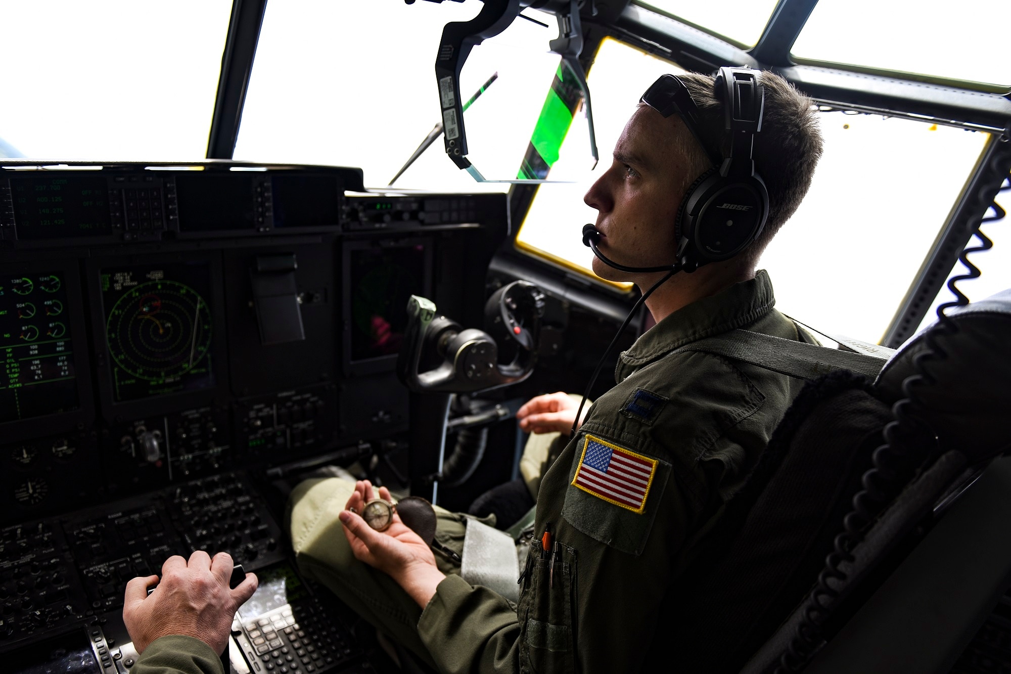 U.S. Air Force Capt. Matthew Coffey, 37th Airlift Squadron pilot, flies over Normandy, France, with his grandfather’s compass in a C-130J Super Hercules June 3, 2017. Coffey’s grandfather, Donald, served in WWII as a half-track driver and was wounded in Normandy from an artillery shell while performing his duties approximately a month after D-Day. (U.S. Air Force photo by Senior Airman Devin Boyer)