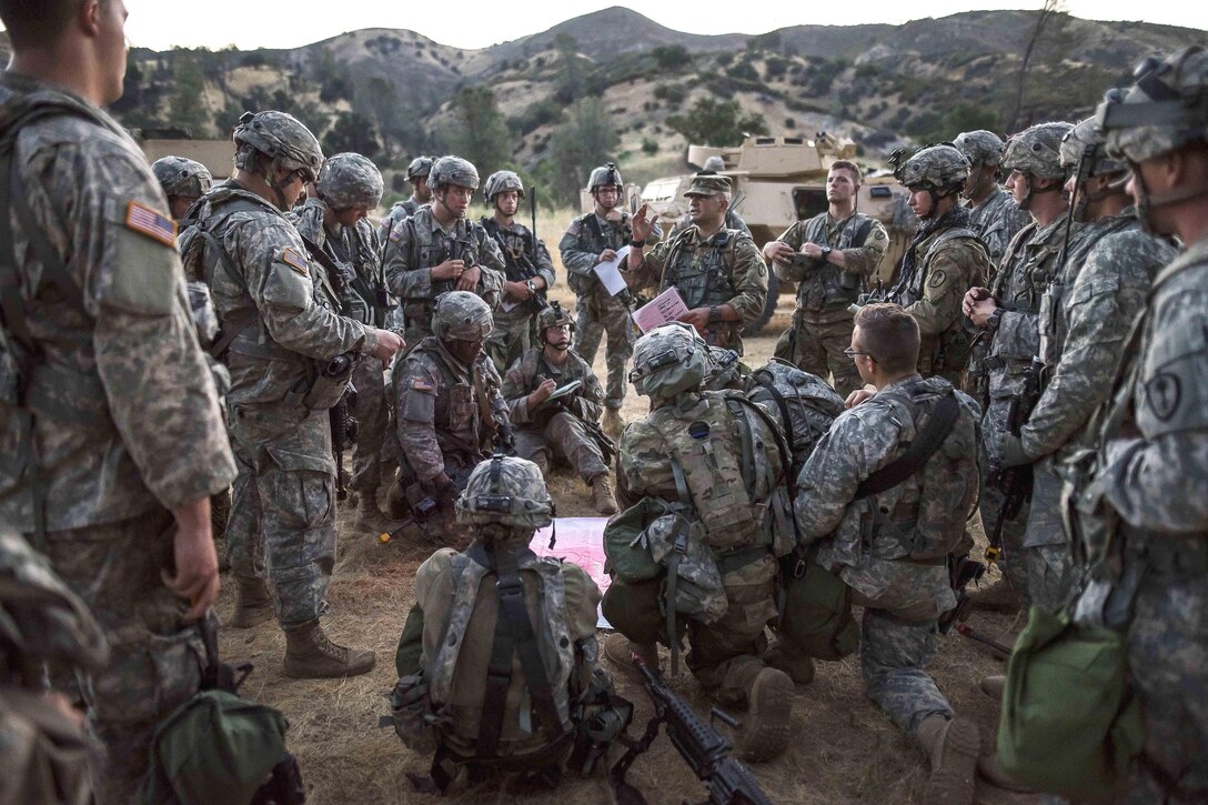 Army reservists attend a convoy briefing before a route reconnaissance movement during Warrior Exercise at Fort Hunter Liggett, California, June 20, 2017. Army photo by Master Sgt. Michel Sauret