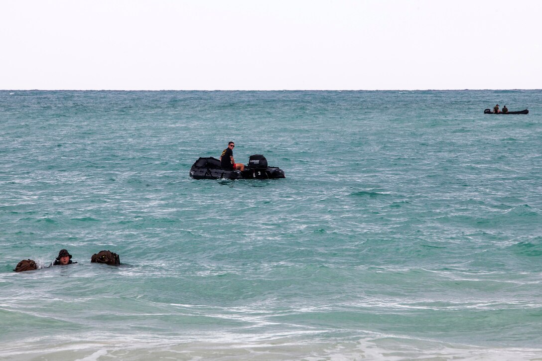 Marines participate in a two kilometer fin swim during an amphibious exercise at Marine Corps Training Area Bellows, Hawaii, June 15, 2017. The Marines are raider reconnaissance team operators assigned to the 3rd Radio Reconnaissance Platoon, 3rd Radio Battalion. Marine Corps photo by Lance Cpl. Luke Kuennen